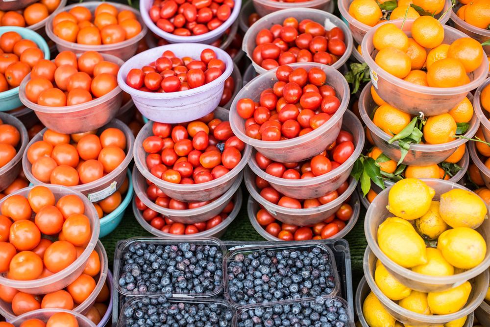 Tomatoes, Oranges, and Lemon display at Ridley Road Market, London