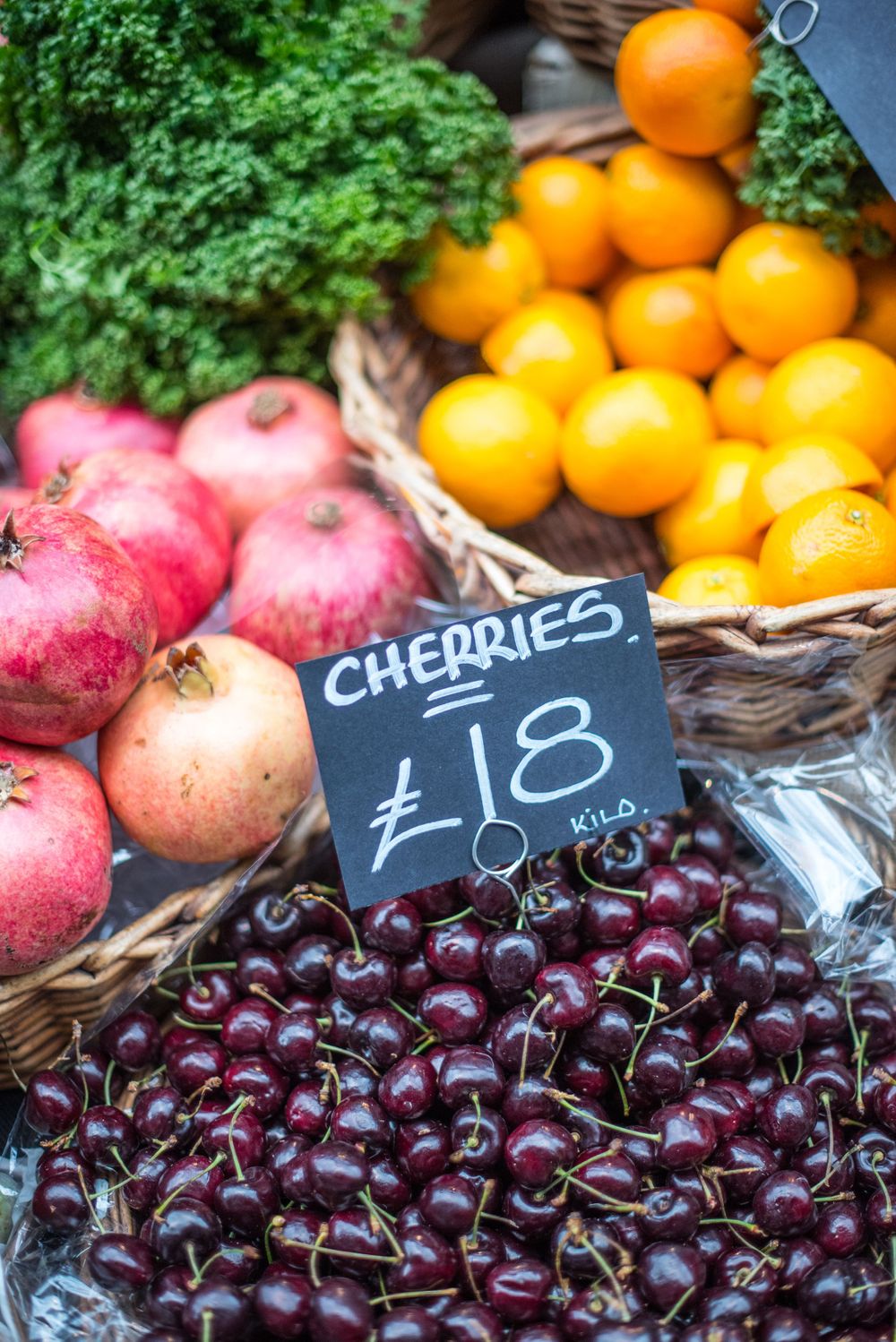Cherries, oranges, and pomegranates at Borough Market, London