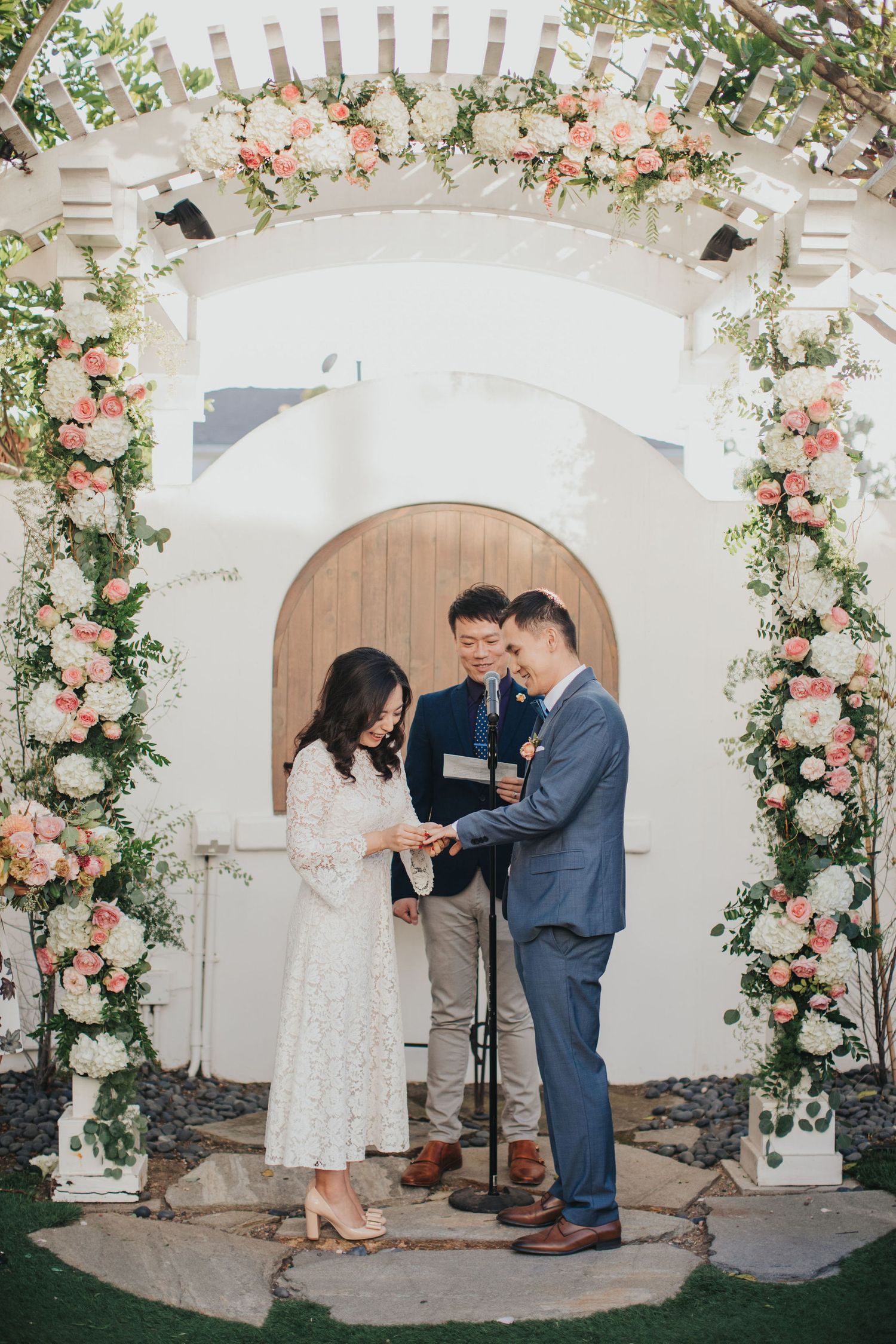 bride puts ring on groom at verandas manhattan beach