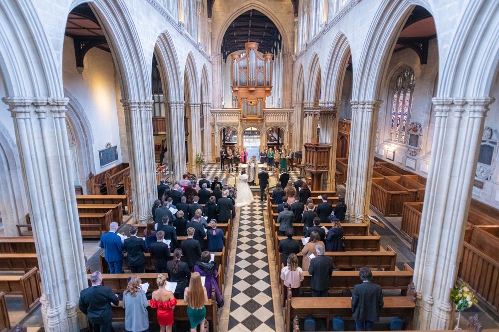 looking over the balcony at The University Church of St Mary the Virgin Wedding