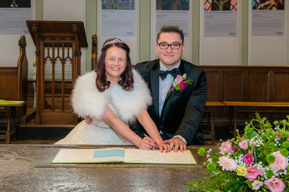 signing the register at The University Church of St Mary the Virgin Wedding