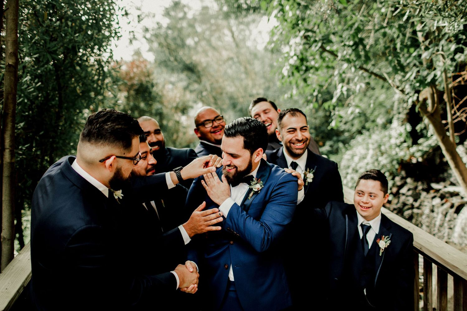 groomsmen casual pictures congratulating groom