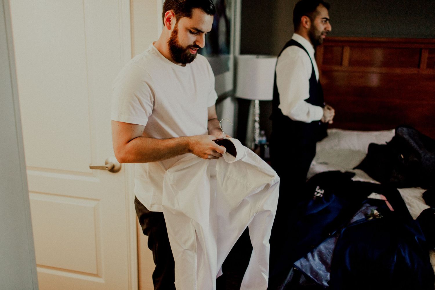 groom prepping for wedding day at holiday inn