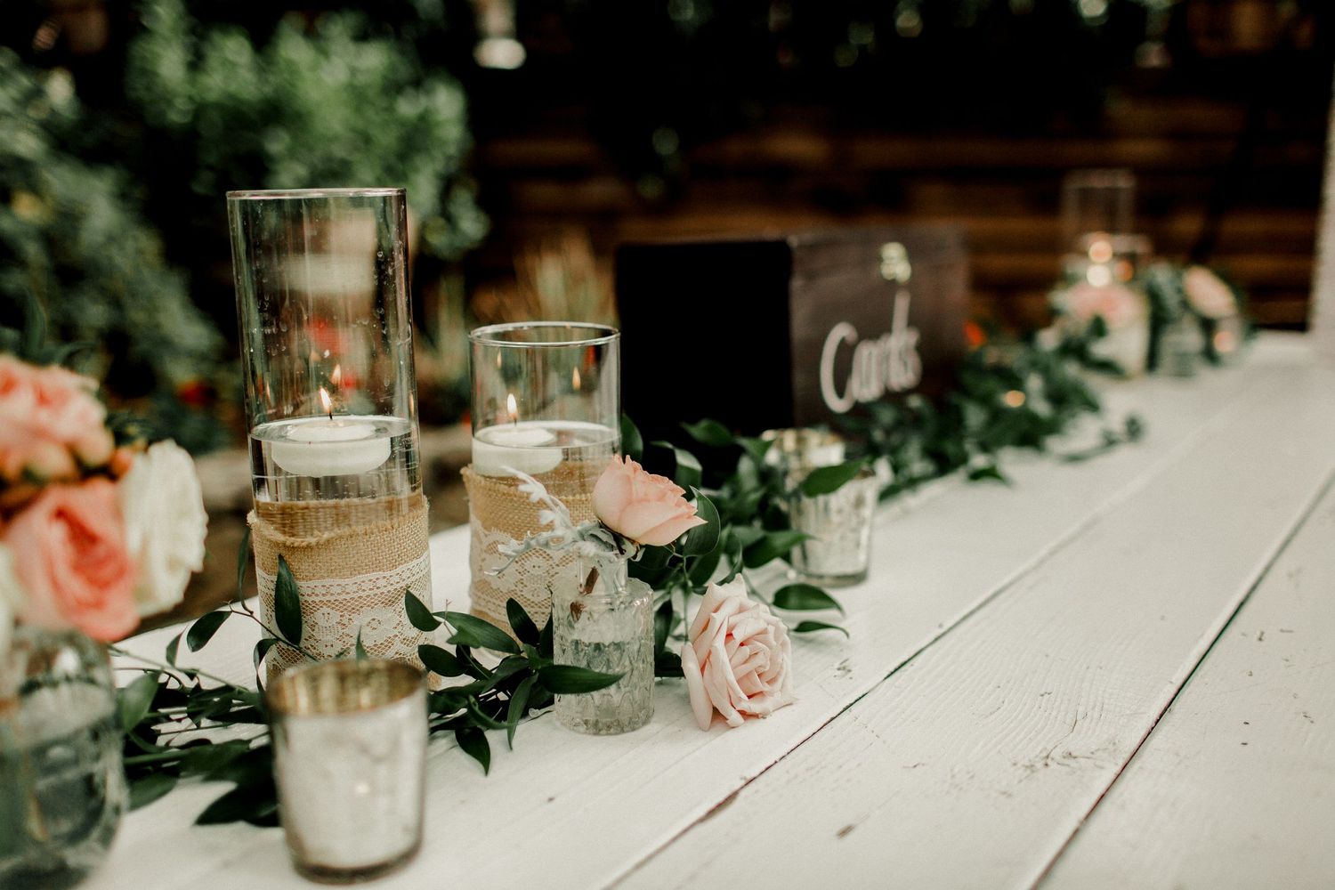 candles on welcome table at wedding