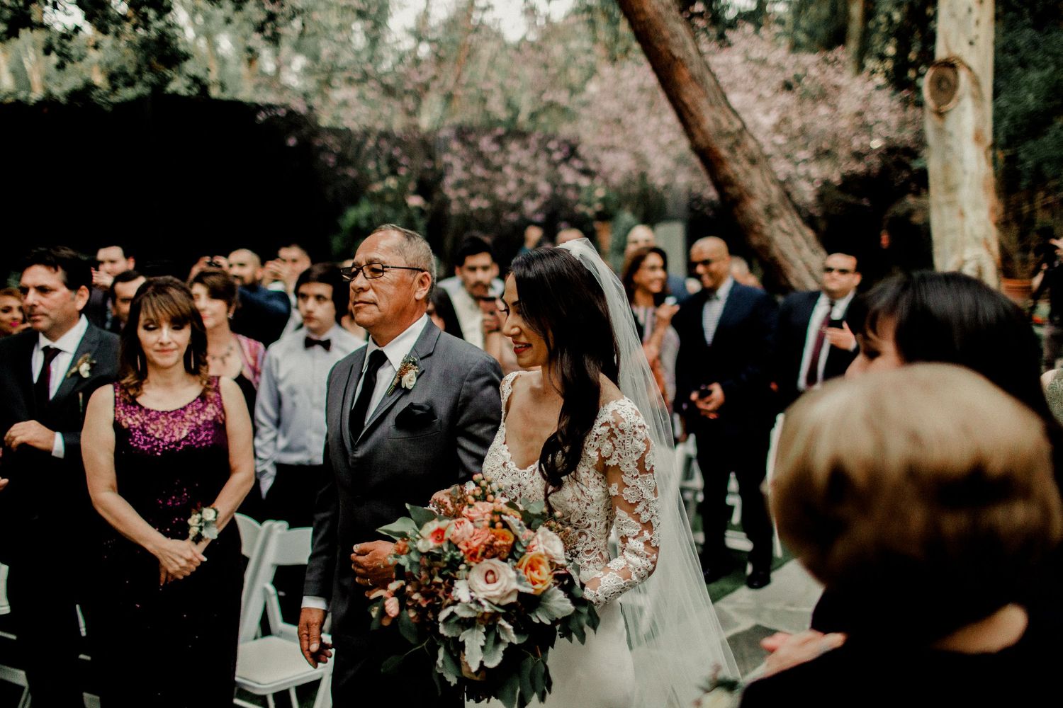 bride and groom walking down wedding aisle