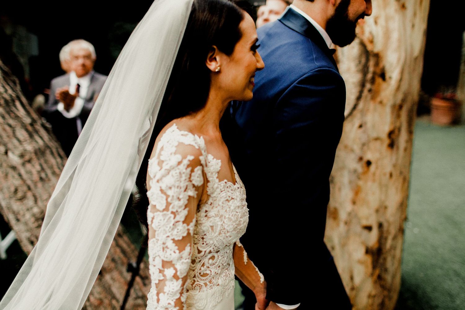 bride and groom walking down aisle passing by