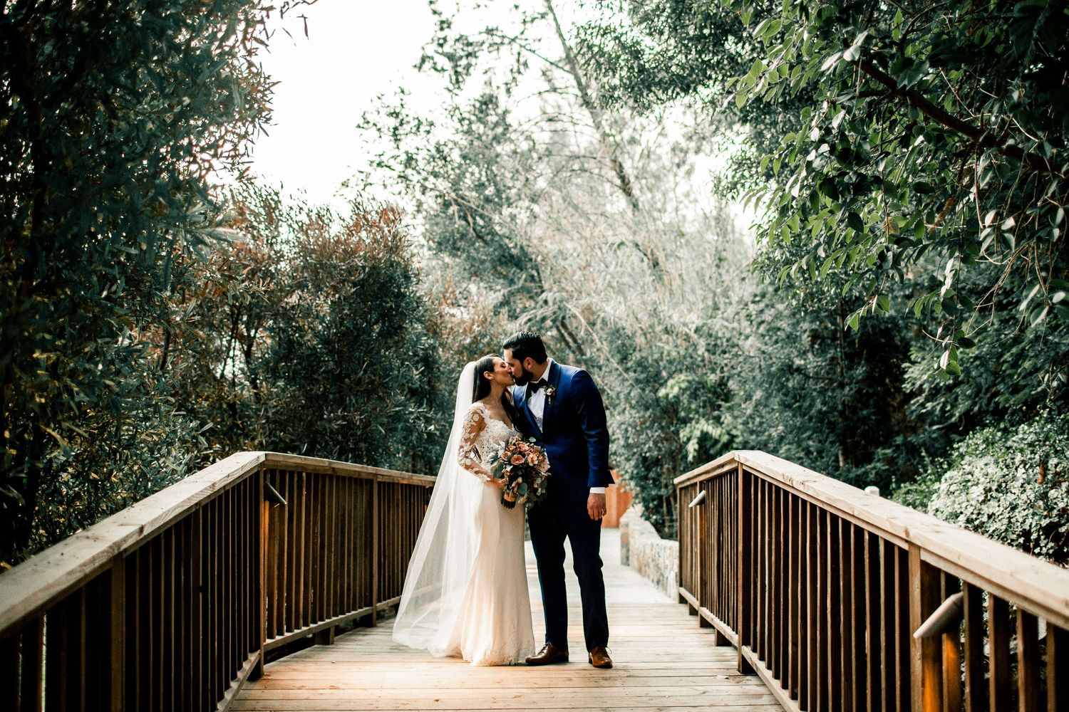 bride and groom portrait session calamigos ranch kissing