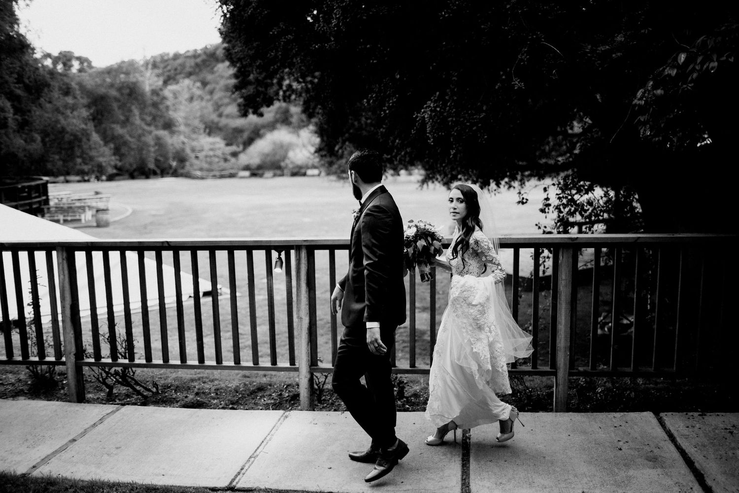 bride and groom walking away