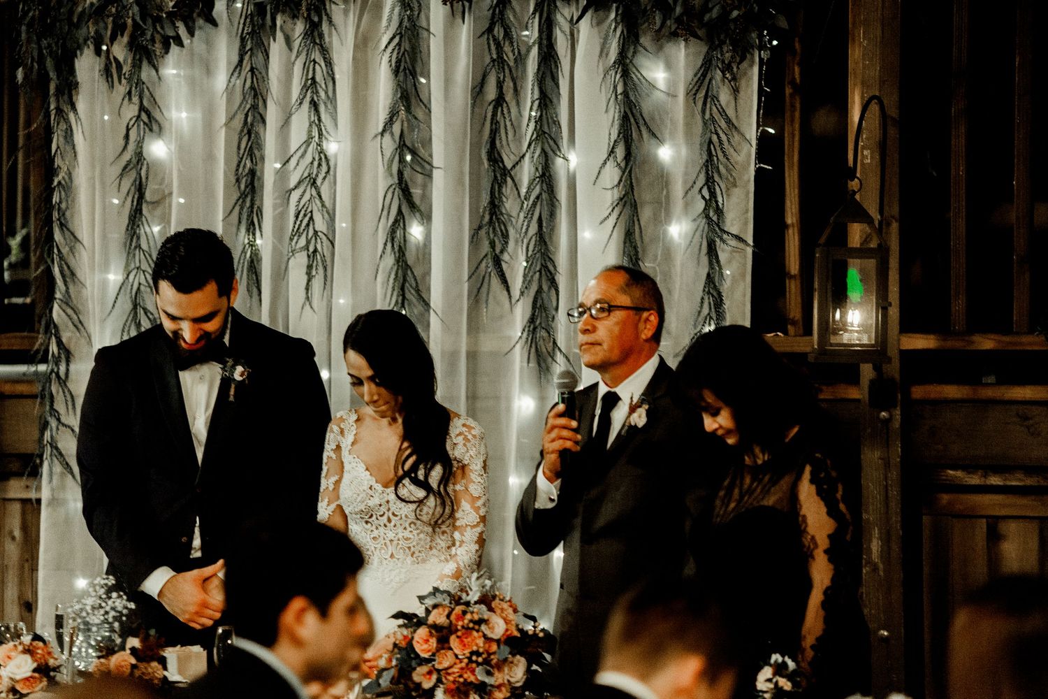 father praying for wedding reception