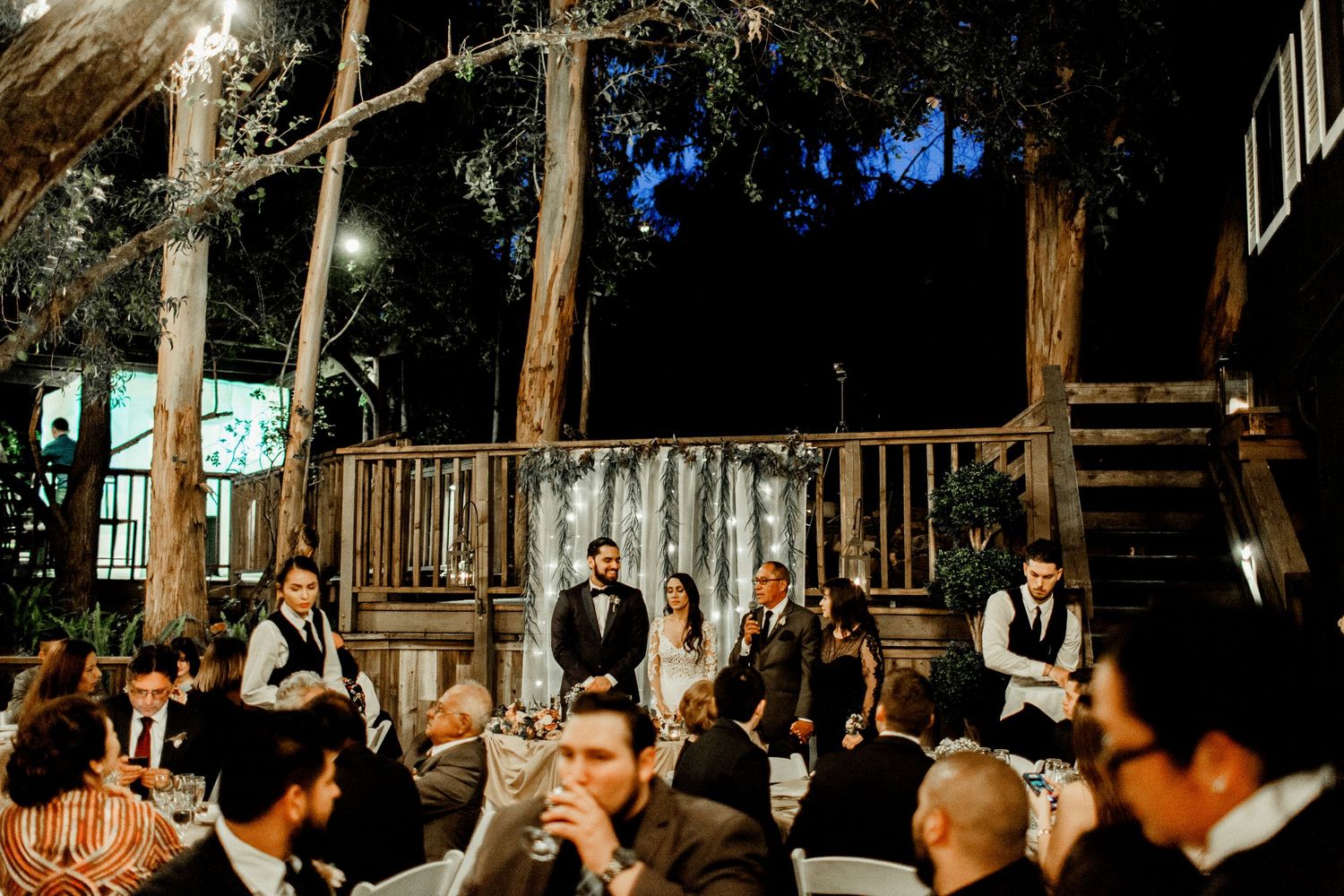 wide shot of father saying speech at rodaina and robert's wedding at calamigos ranch malibu