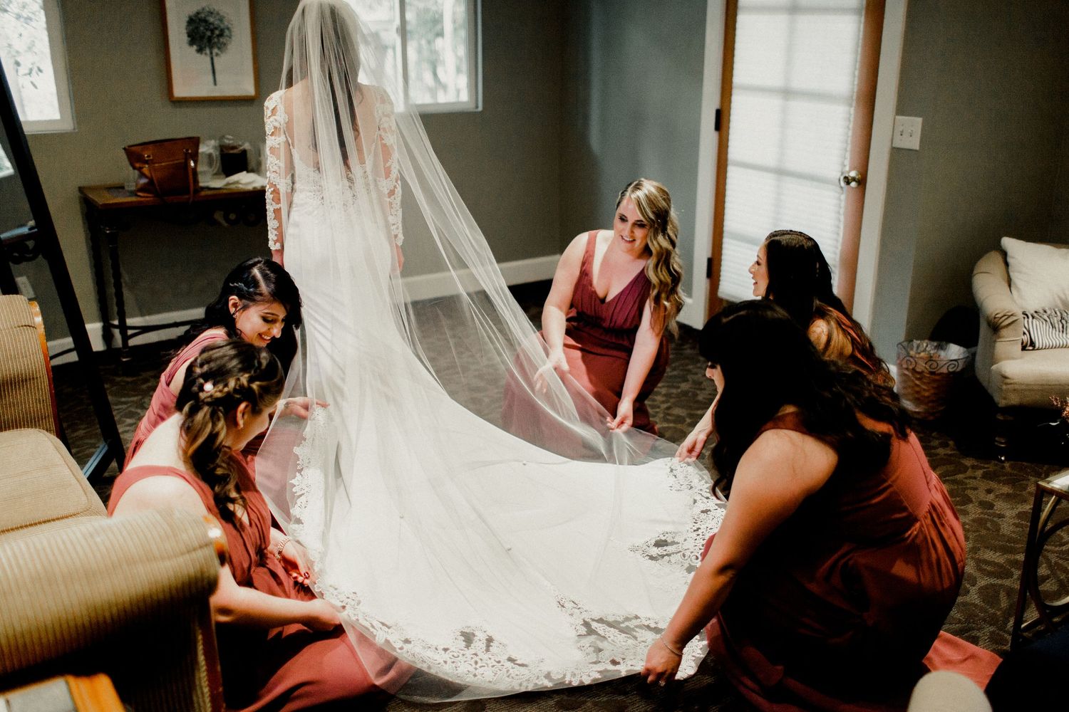bridal party helping dress