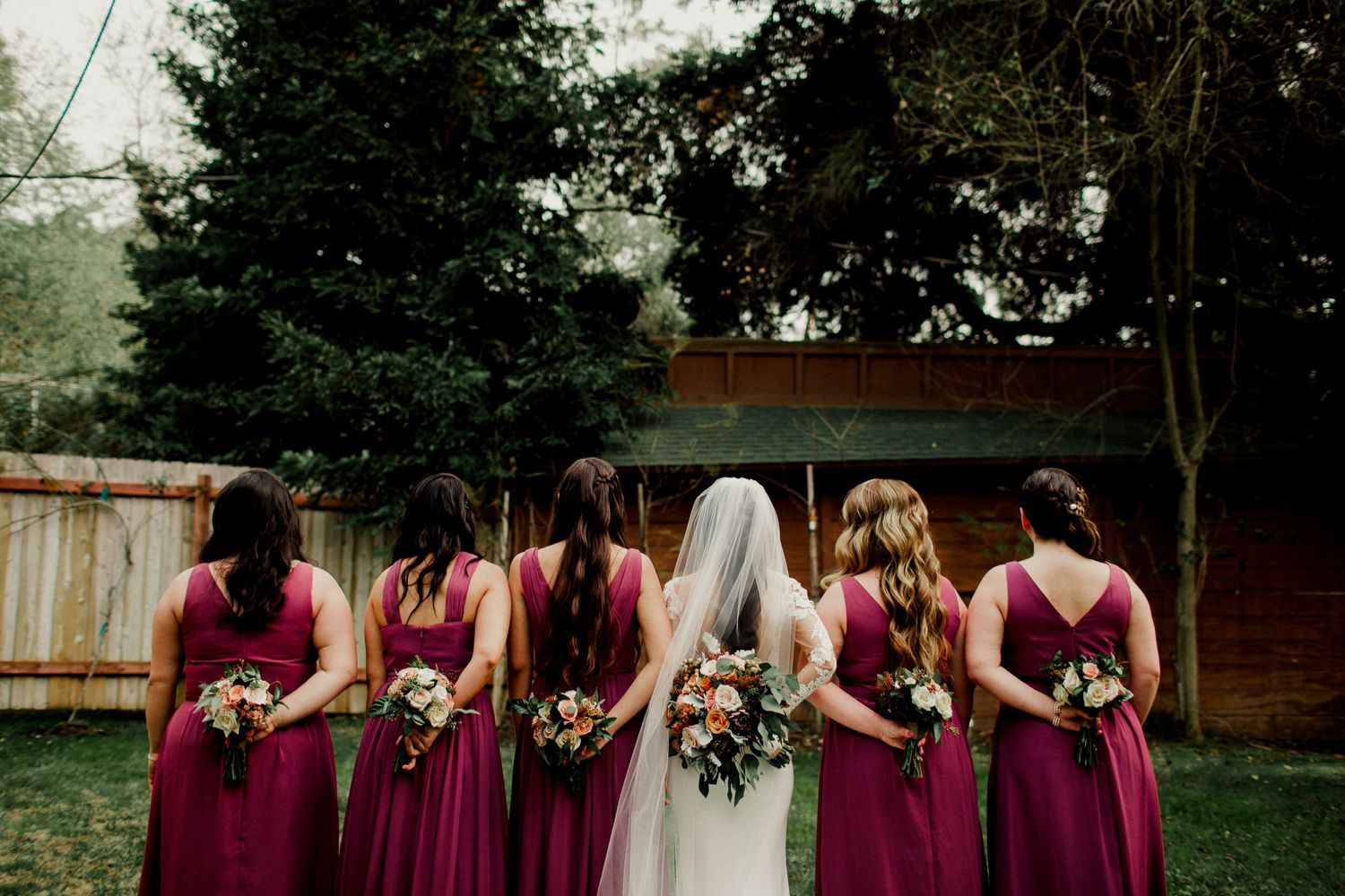 back of bridesmaids and bouquet