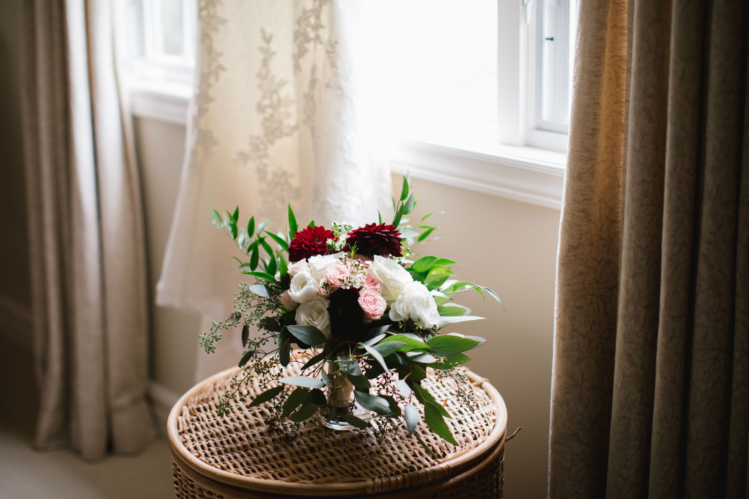 bouquet on round wicker hamper