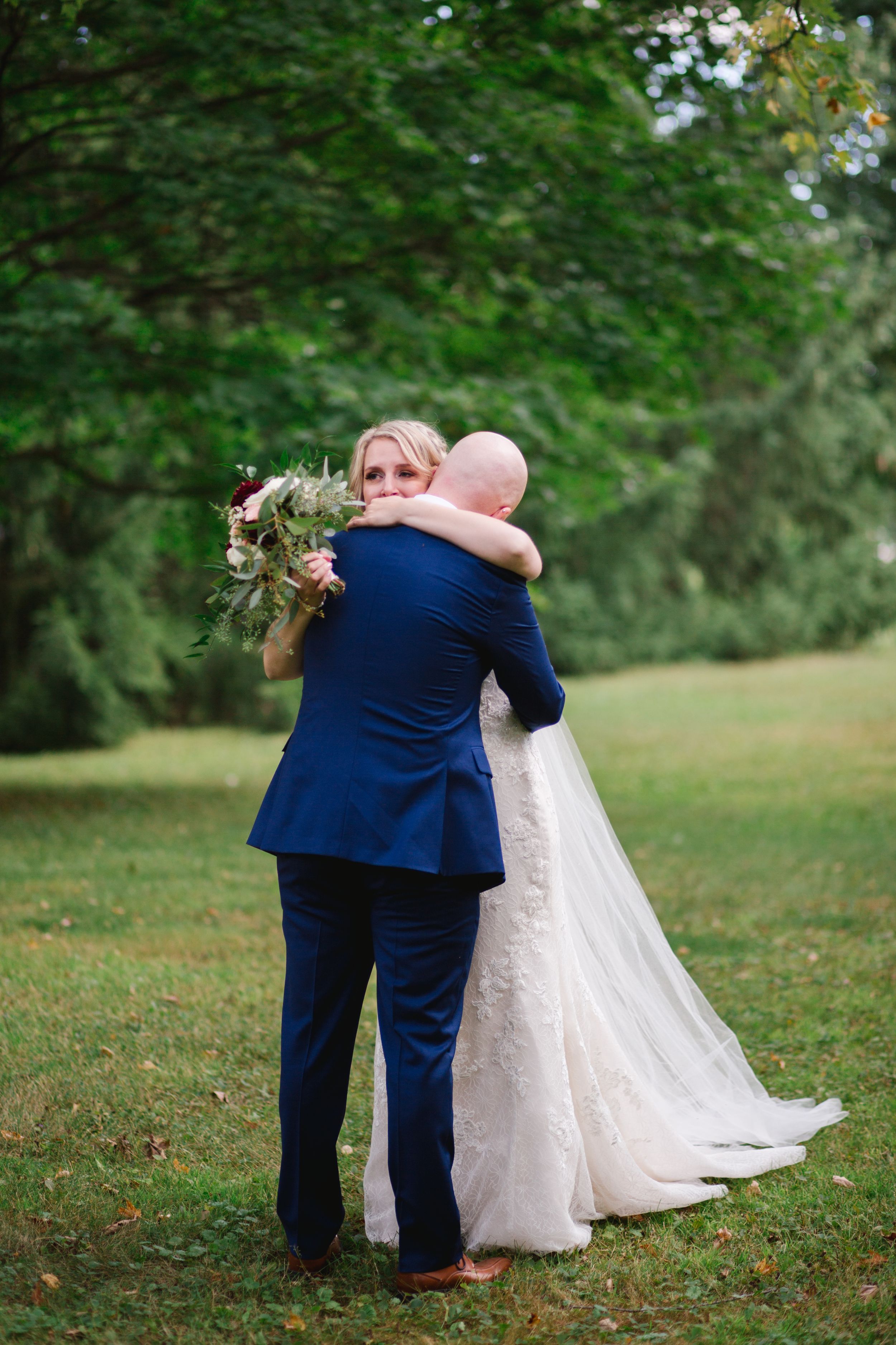 bride and groom hugging and crying in toronto