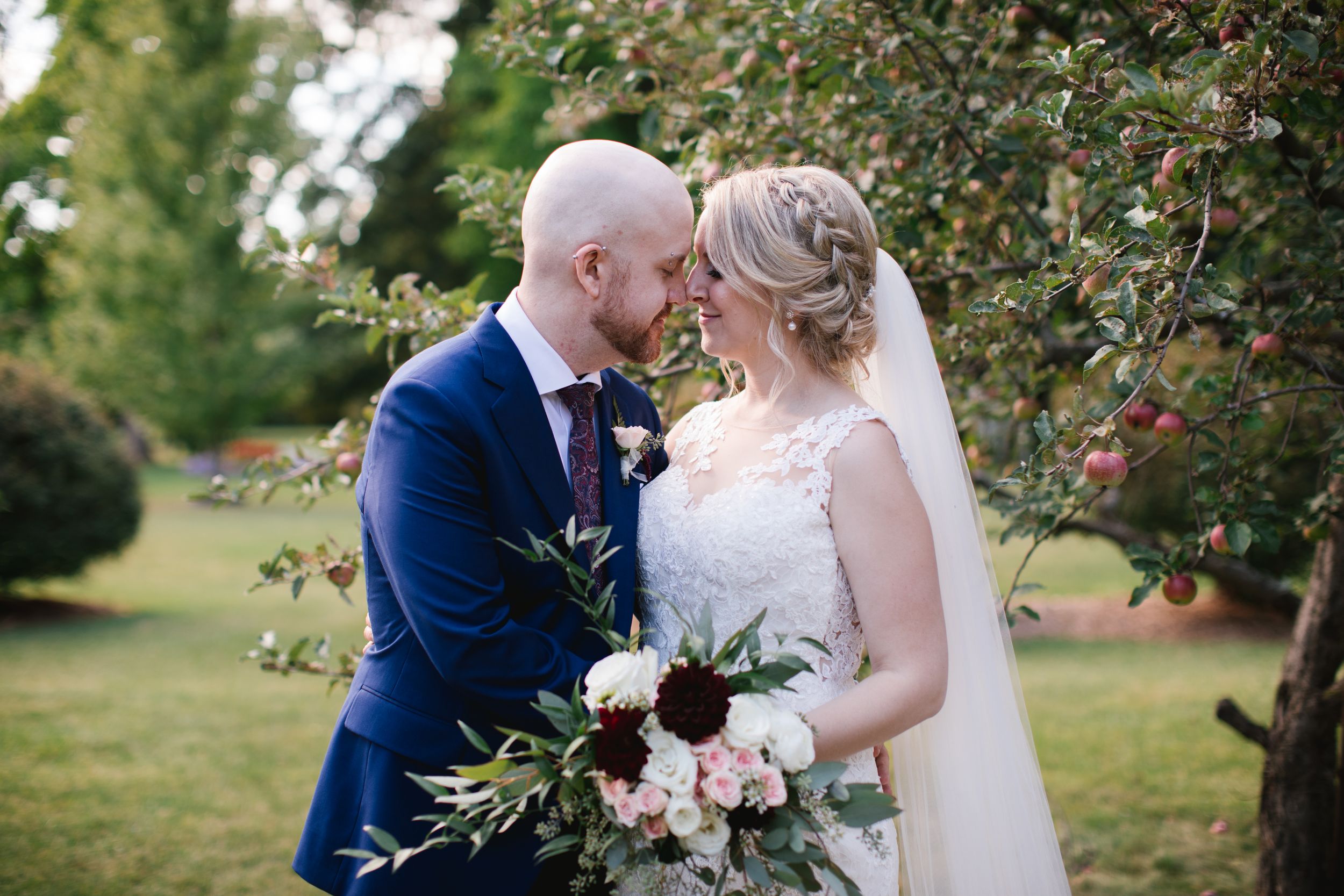 bride and groom snuggling in apple orchard shouldice hospital thornhill