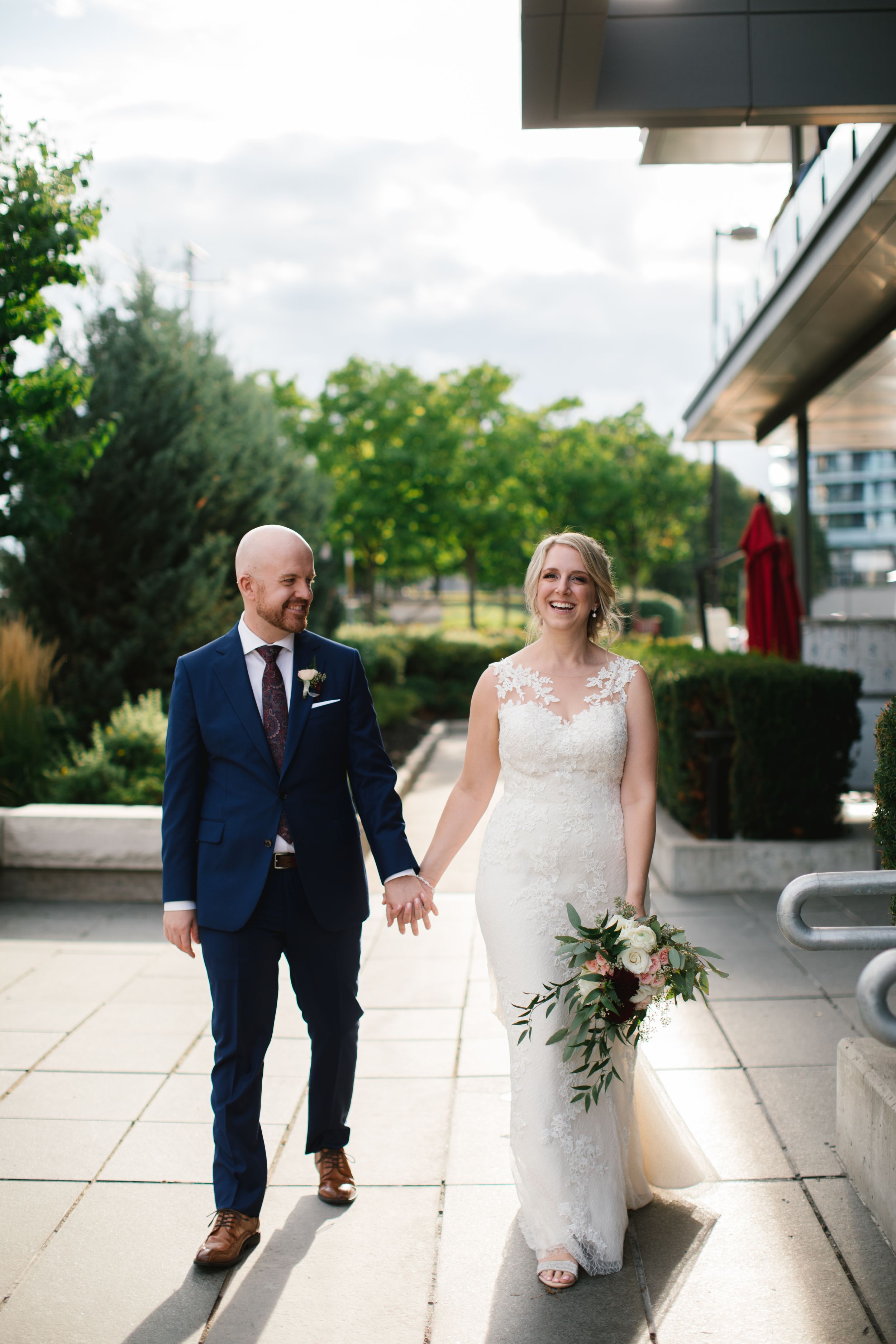 bayview village loft events bride and groom during sunset walking and laughing