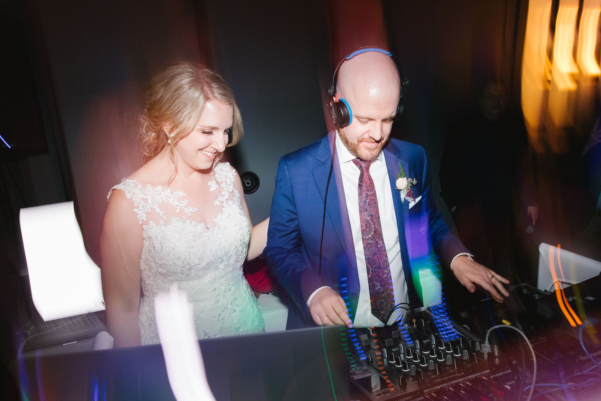 bride and groom dj during wedding reception