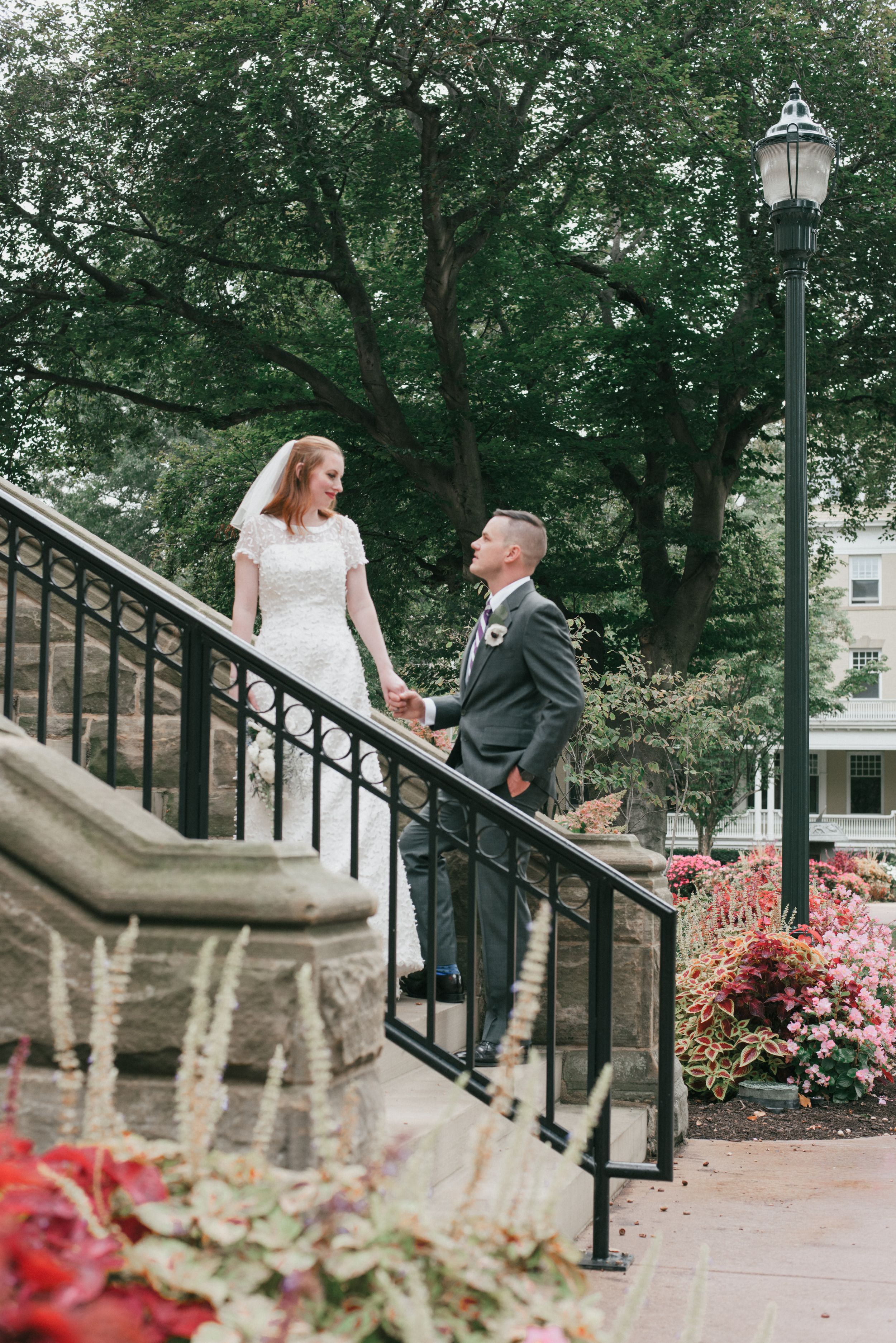 classic wedding bride and groom, on the steps of Clark Hall, Case Western Reserve University, Cleveland
