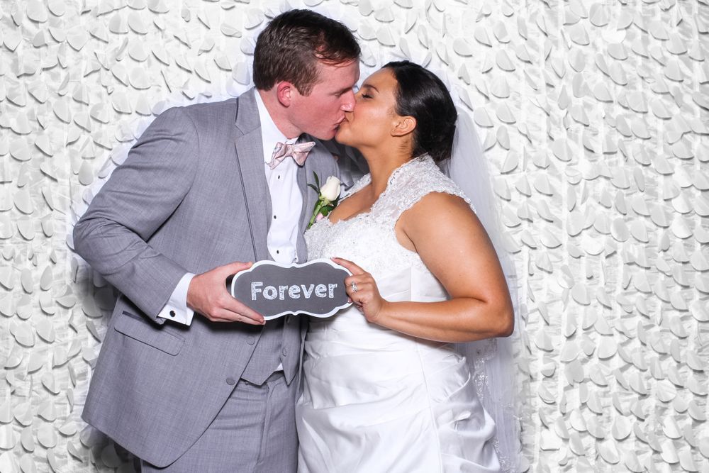 Bride and Groom kiss at Gigglebox Photo Booth