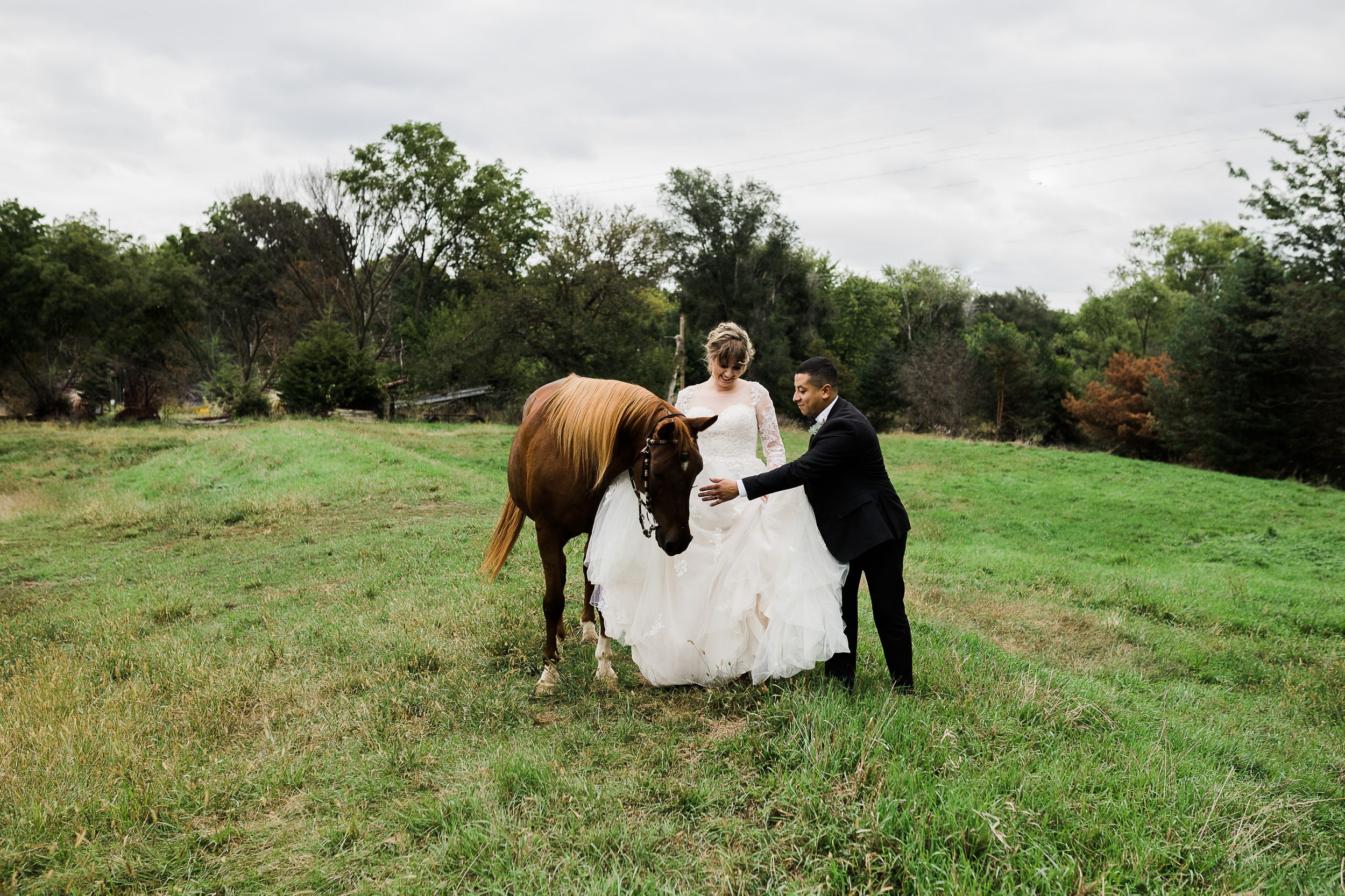 Bride and groom with horse by Hudson Valley photographer