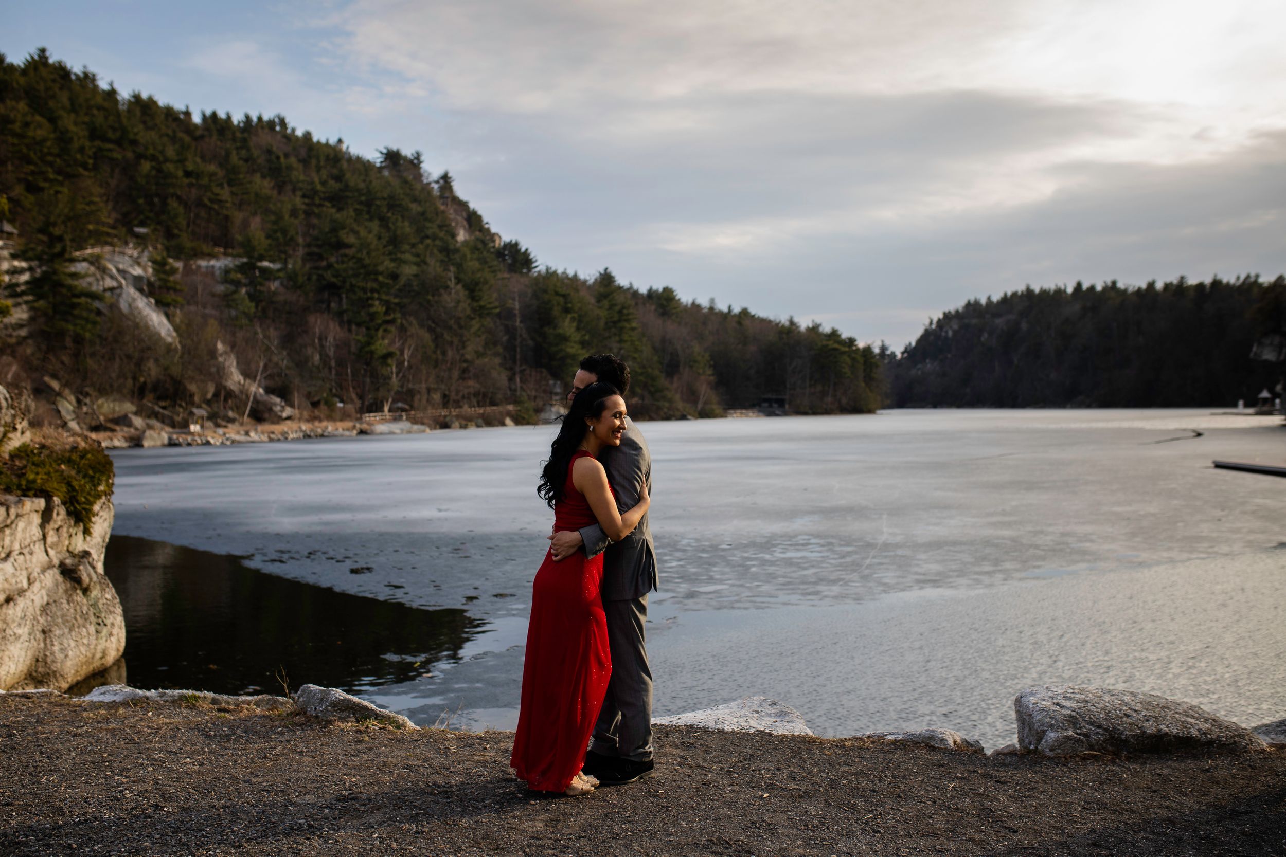 Mohonk Mountain house engagement with bride in long red dress and groom in a suit