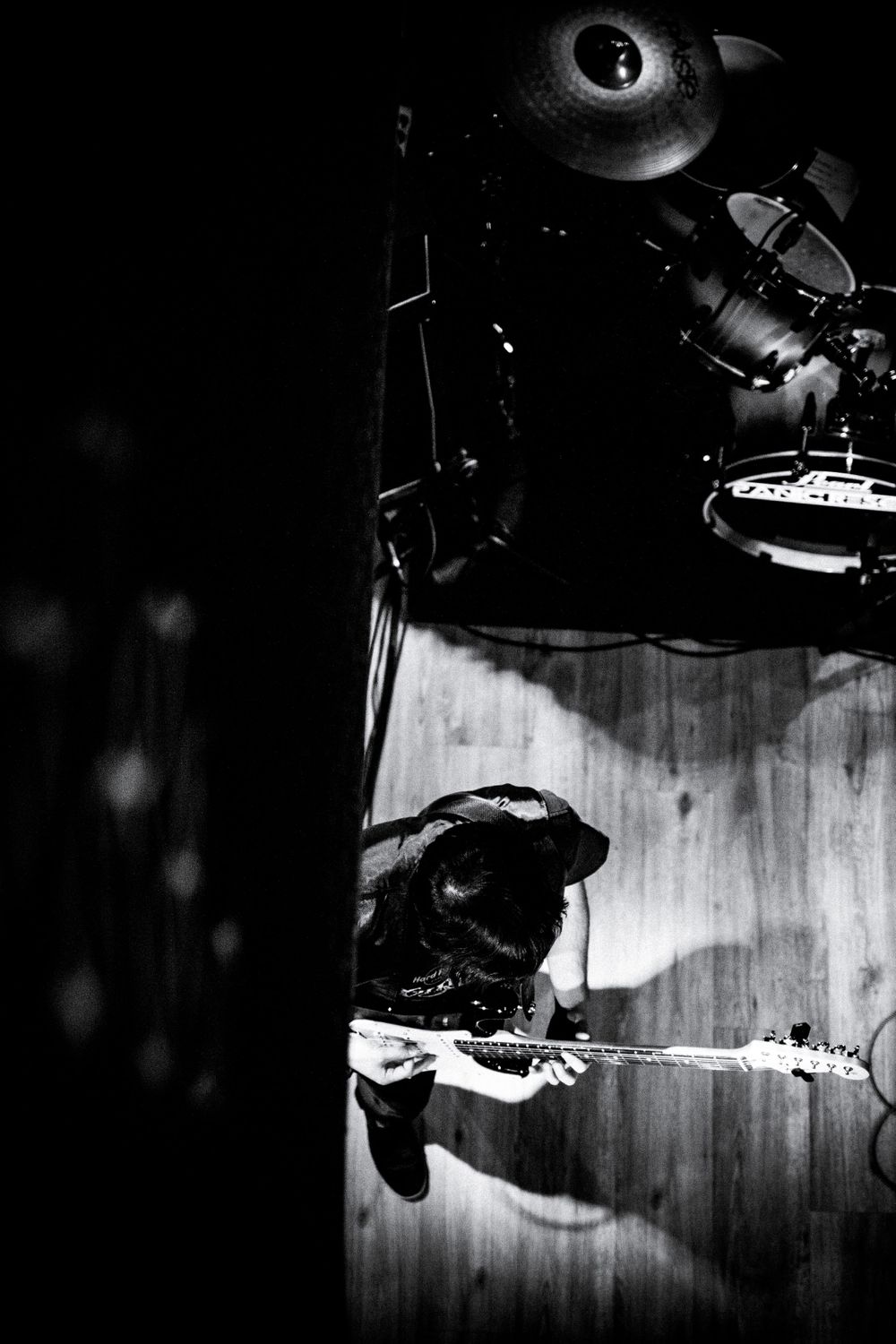 Tiago playing guitar in their band