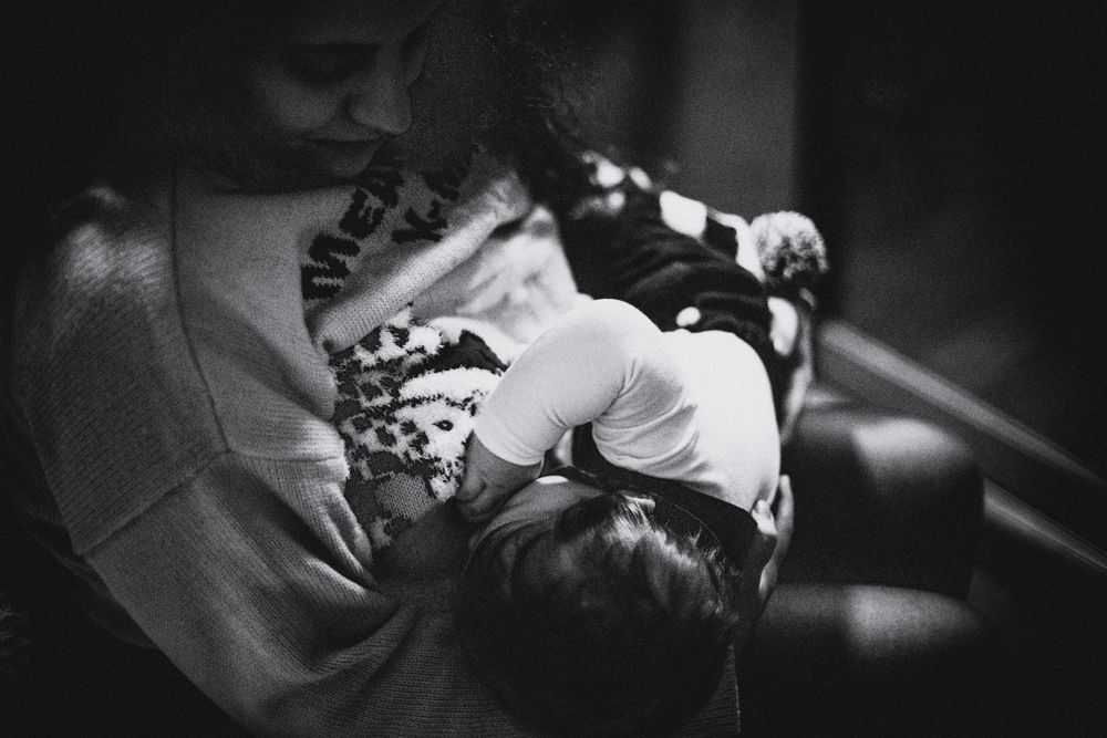 Daniela breastfeeding Diogo (mon breastfeeding son) on their first Christmas together