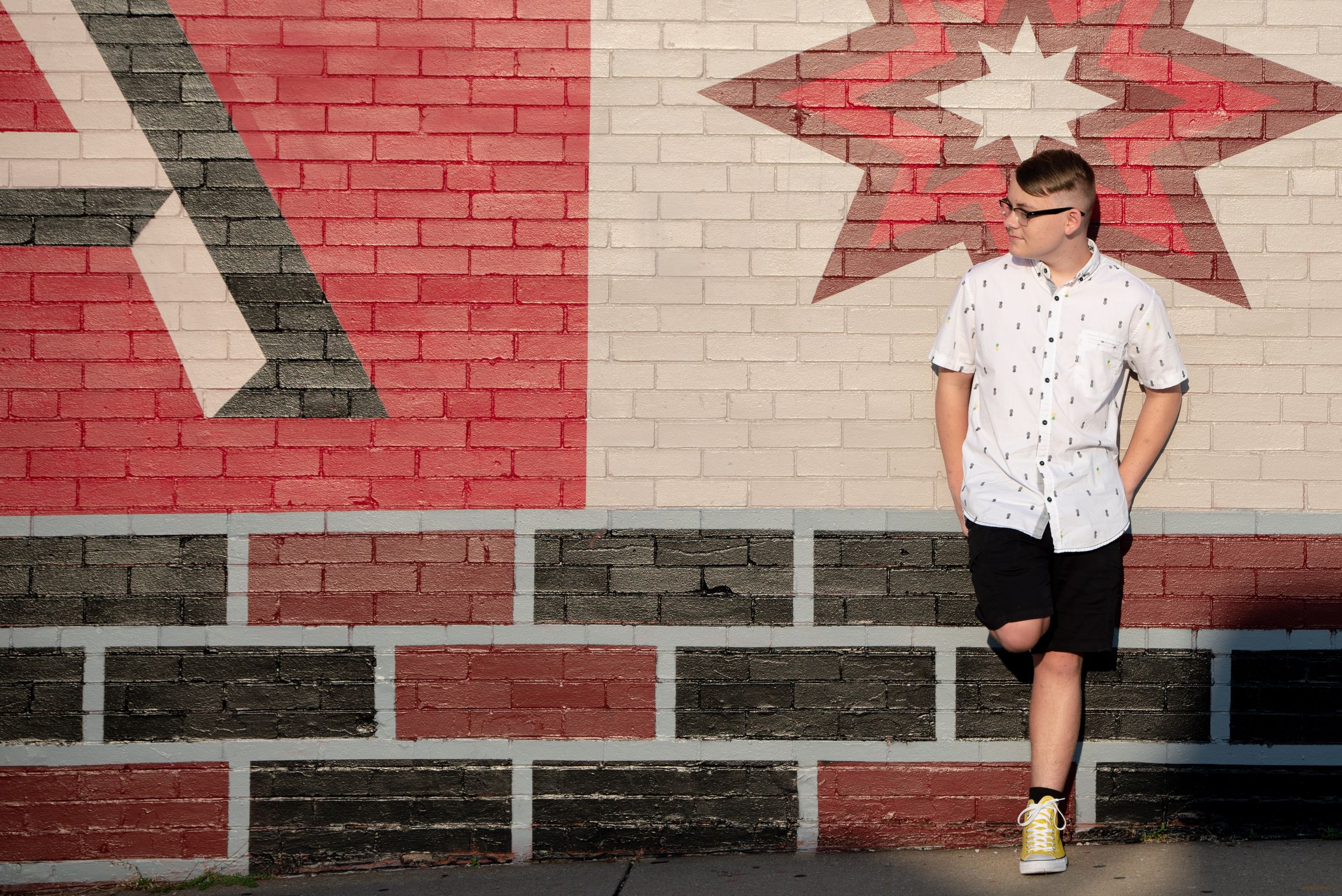 senior in front of Gordon Square mural, Cleveland, Ohio