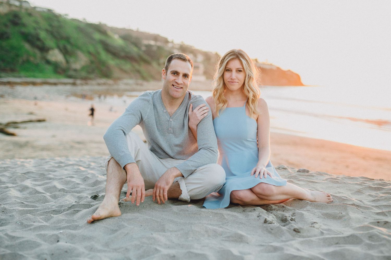 sitting on beach engagement photo