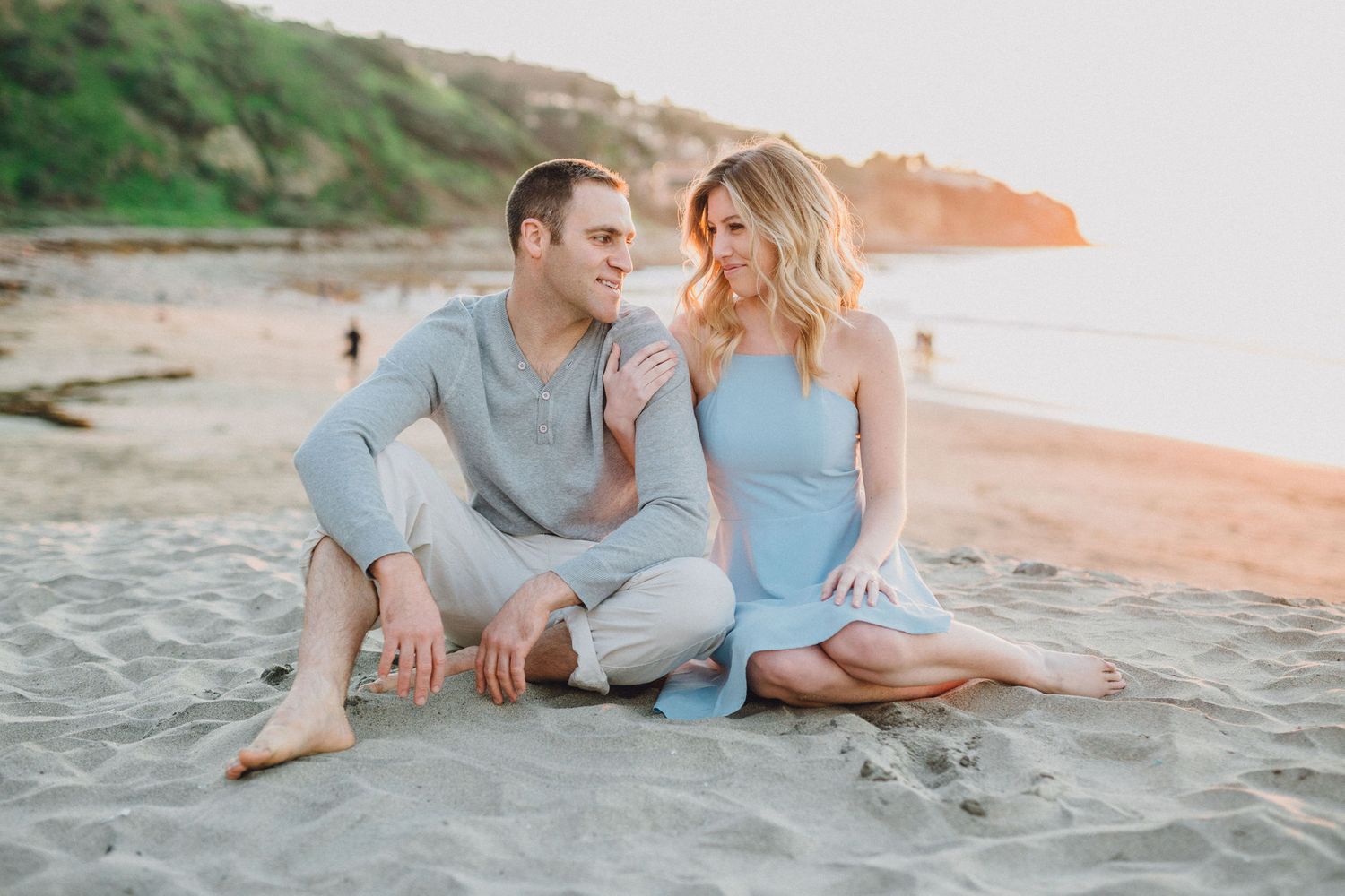 sitting on sand engagement photo