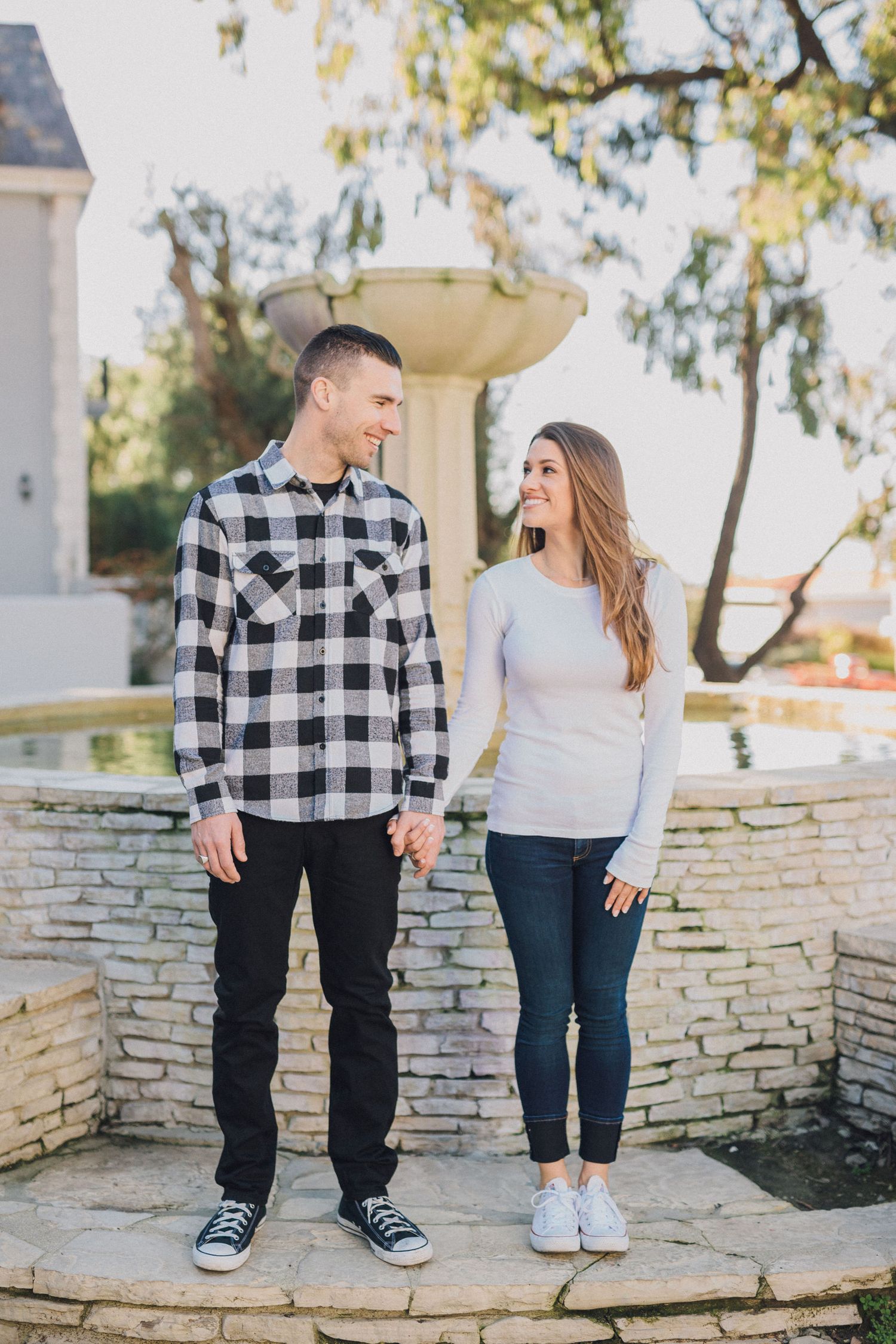 engagement photo in front of fountain