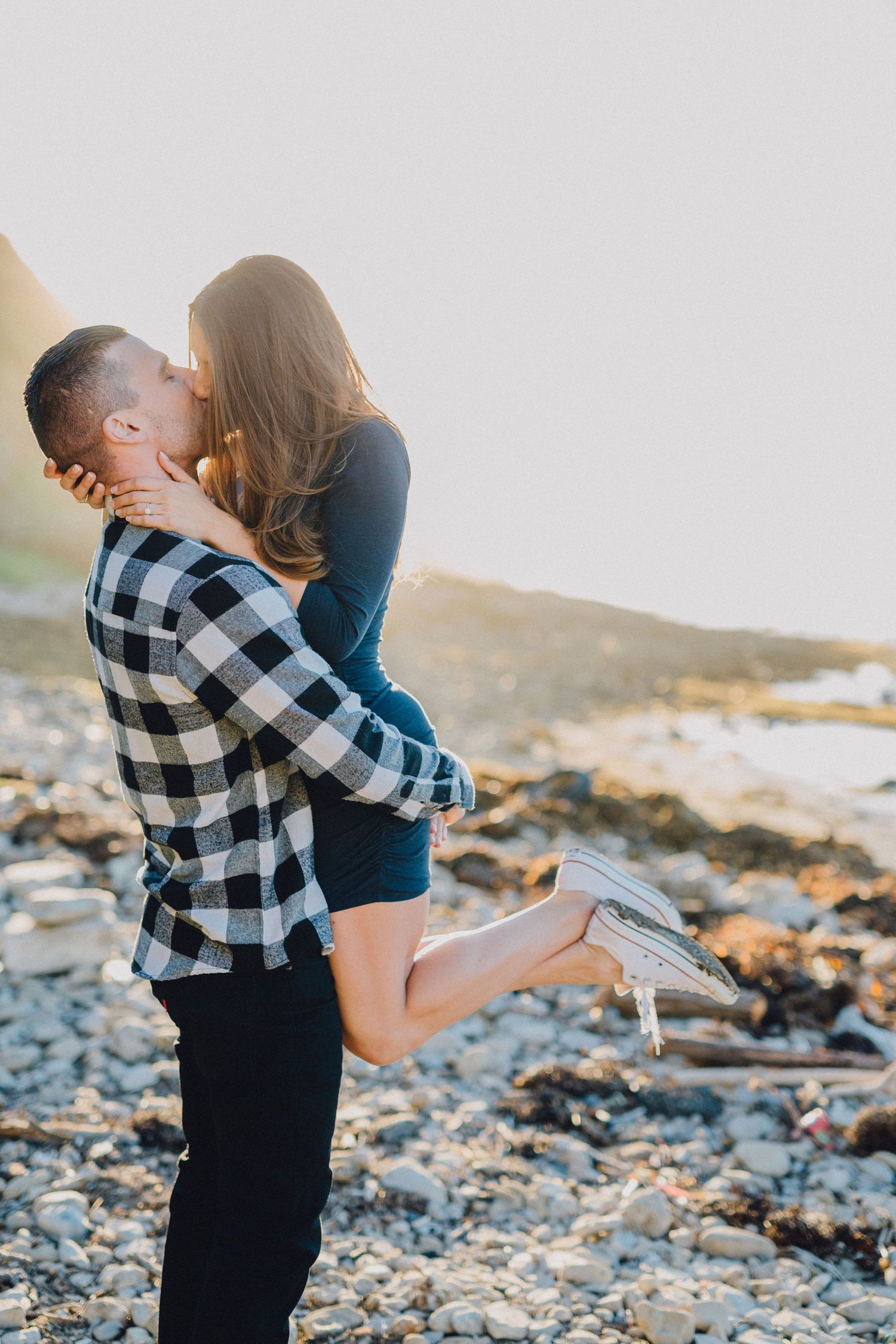 engaged couple kiss at palos verdes beach