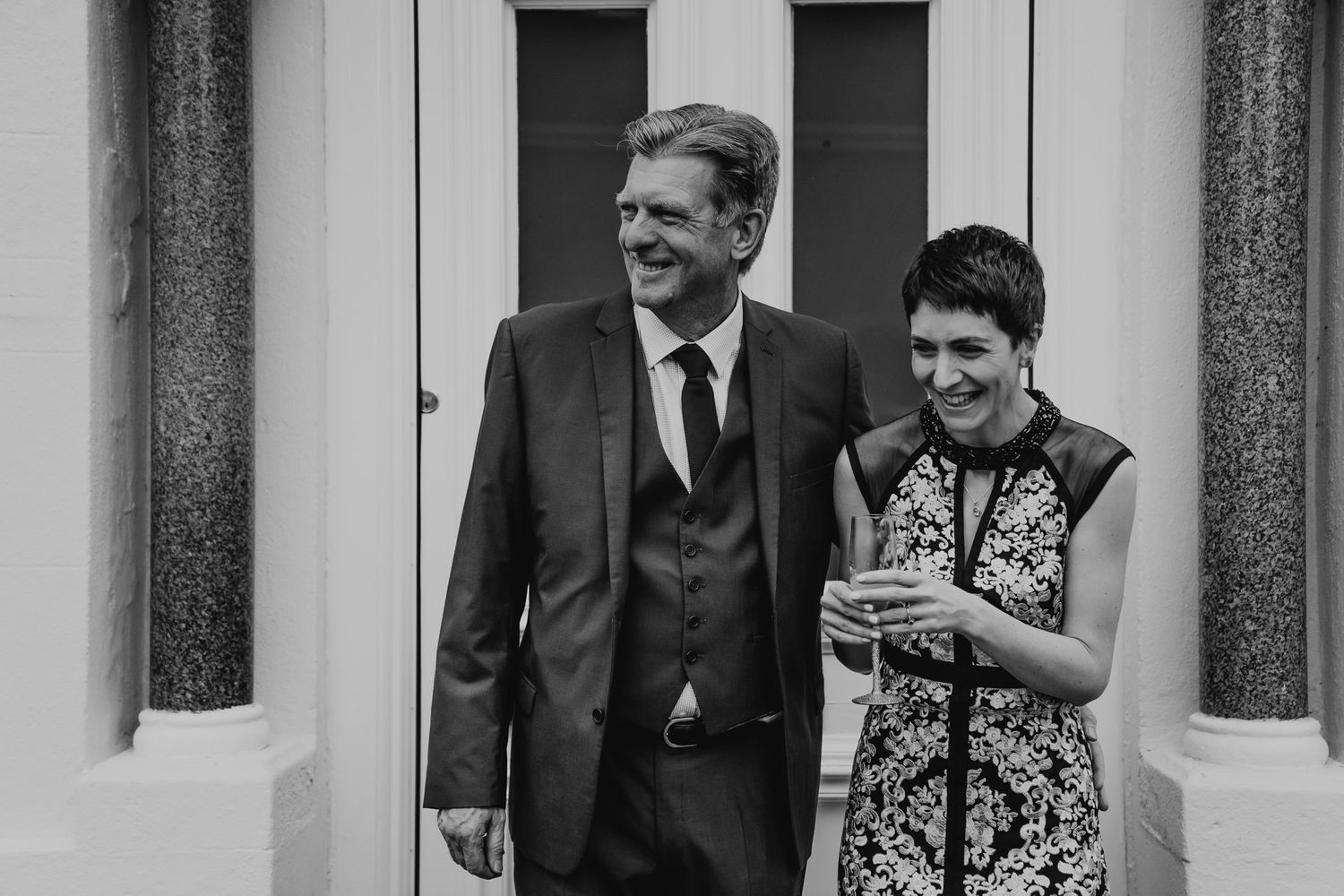 Black and white photo of the bride and her father at their Salisbury home on the wedding morning.