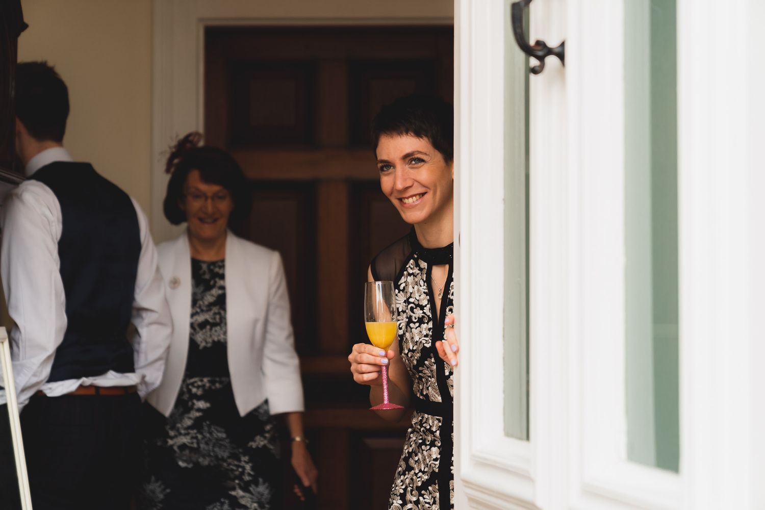 Bride opens the front door at her Salisbury home on the morning of her wedding.