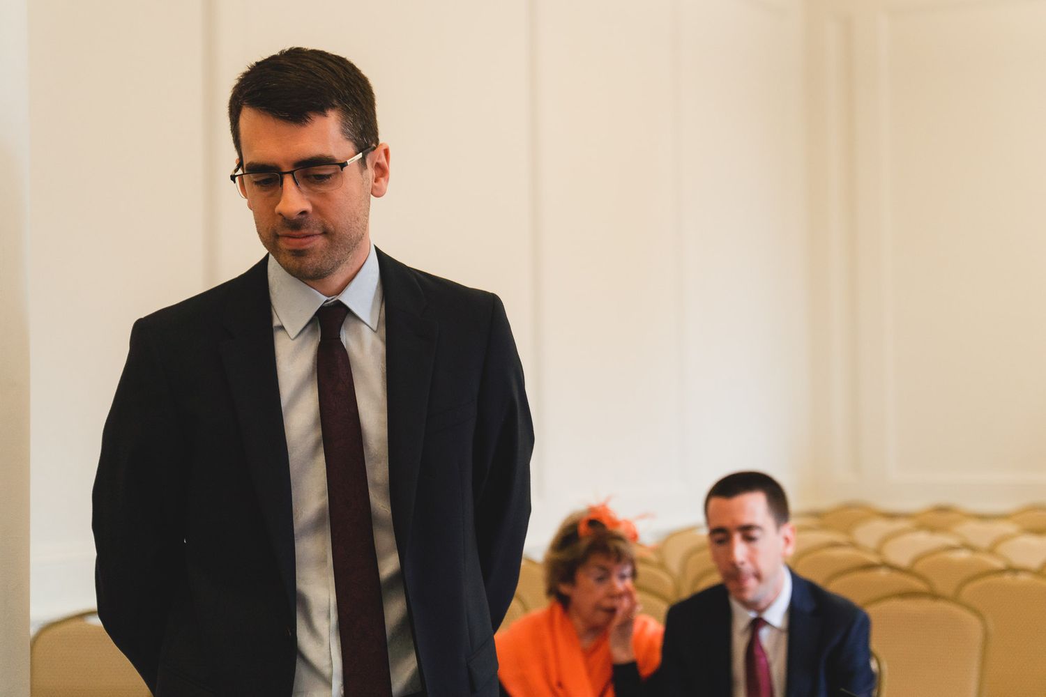 The groom waits nervously in the ceremony room for his bride to arrive. Salisbury Registry Office.