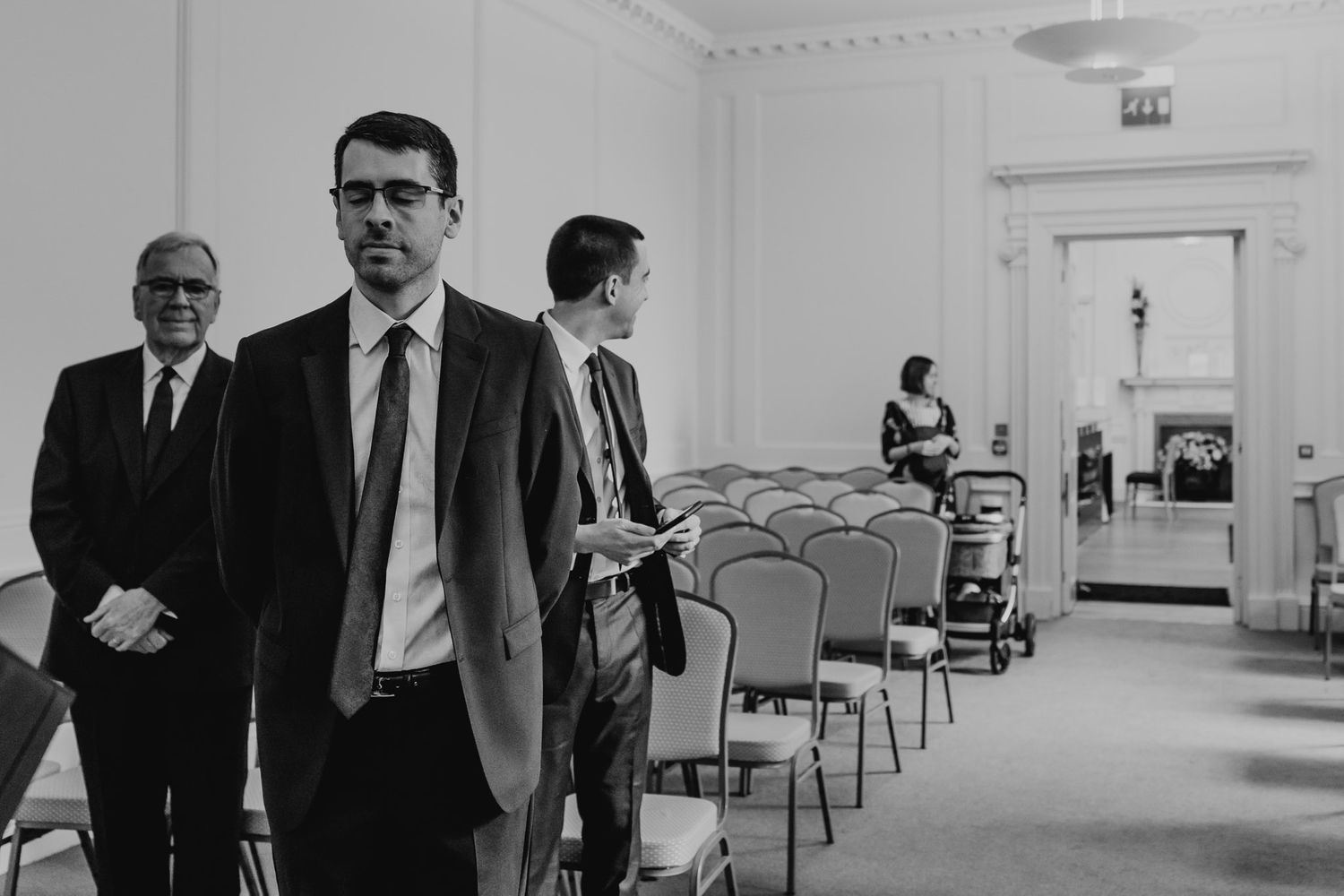 Black and white photo of the bride making her entrance at Salisbury Registry Office.