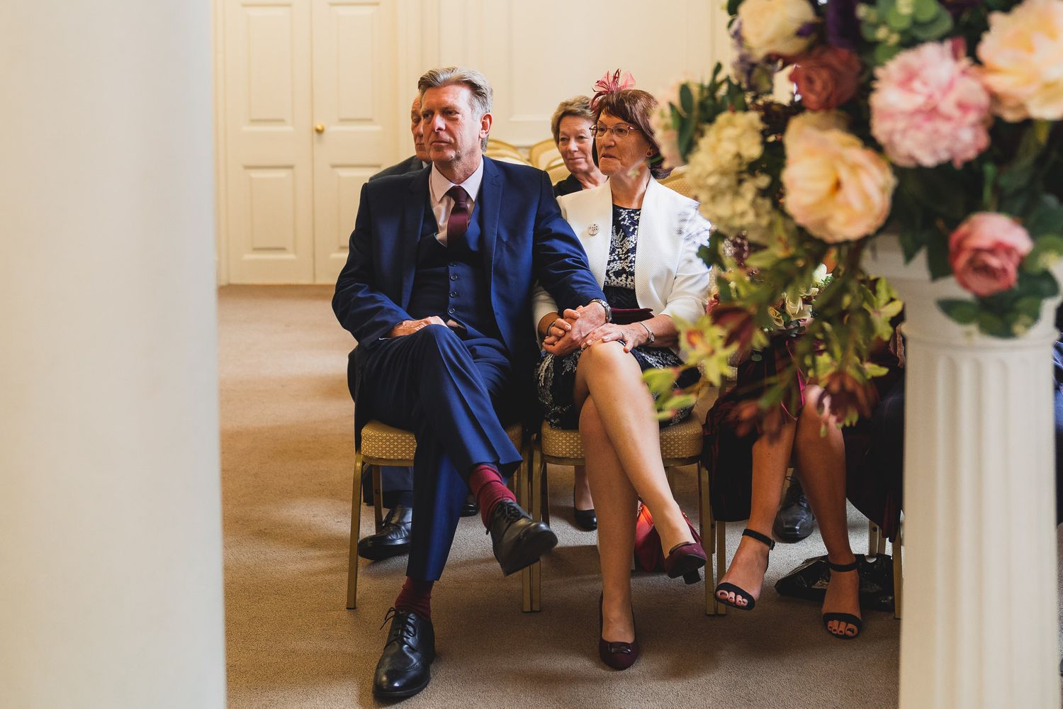 Bride's mother and father look on as their daughter gets married at Salisbury Registry Office.