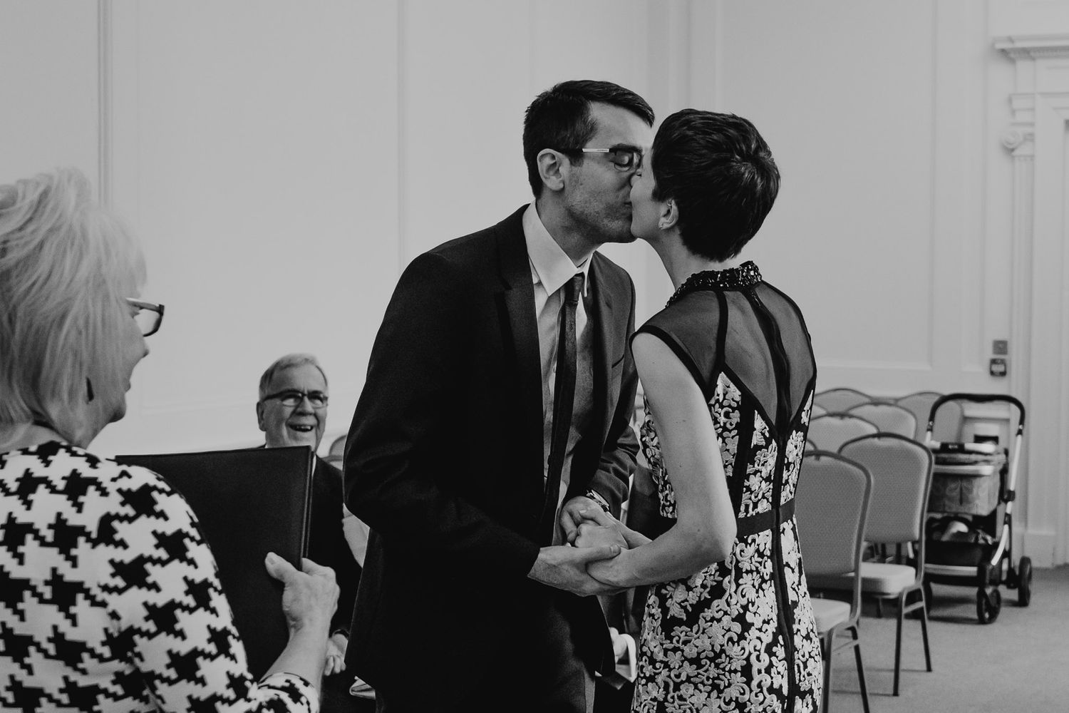Black and white photo of bride and groom's first kiss at Salisbury Registry Office.