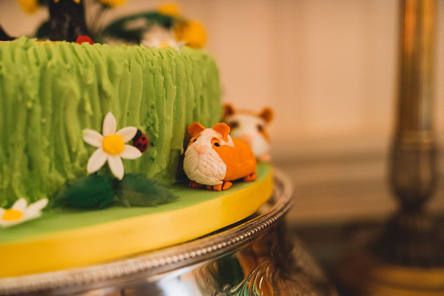 Icing ginger guinea pig on a wedding cake.