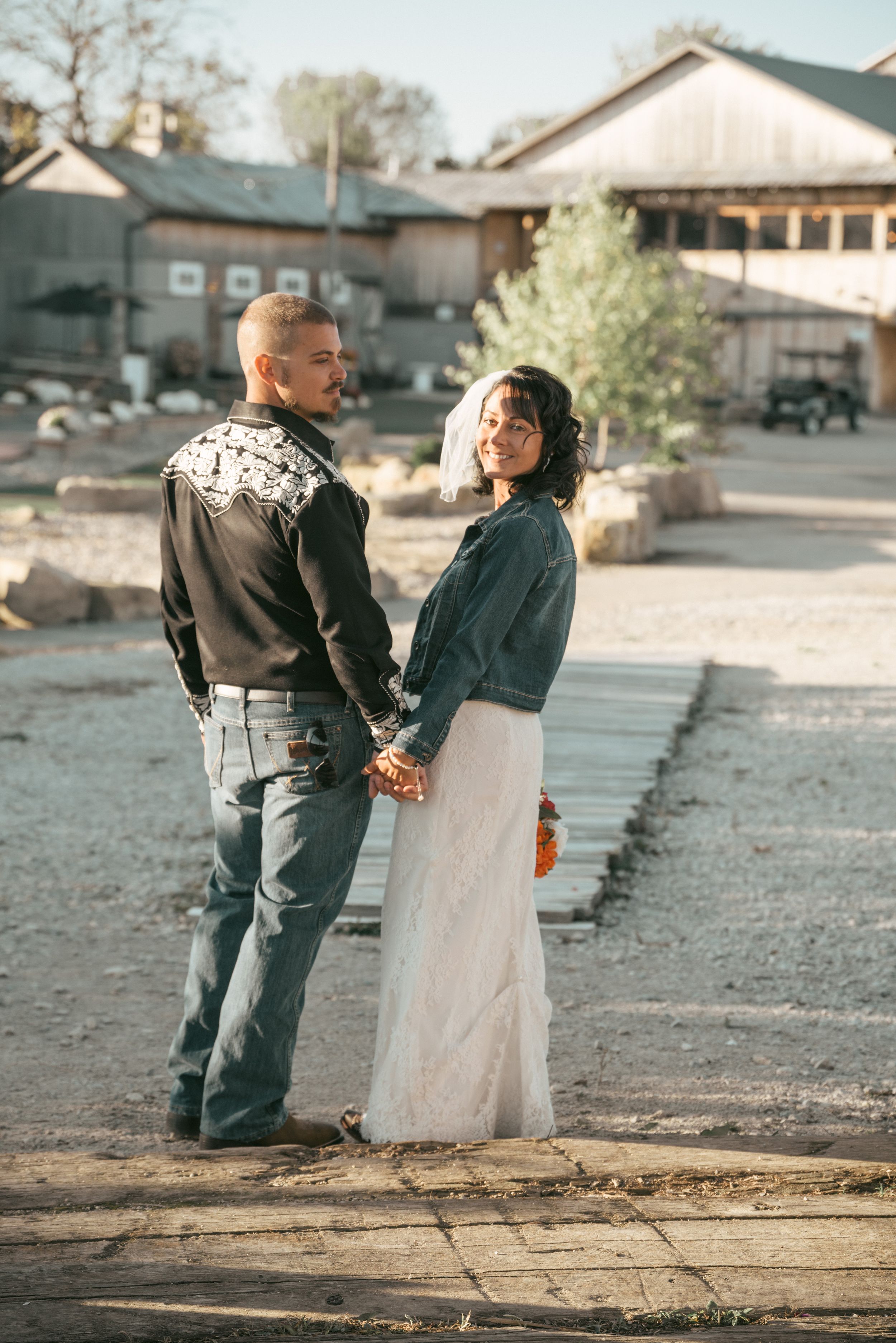 groom Western shirt, bride in David's Bridal gown and denim, White Birch Barn, Medina, Ohio