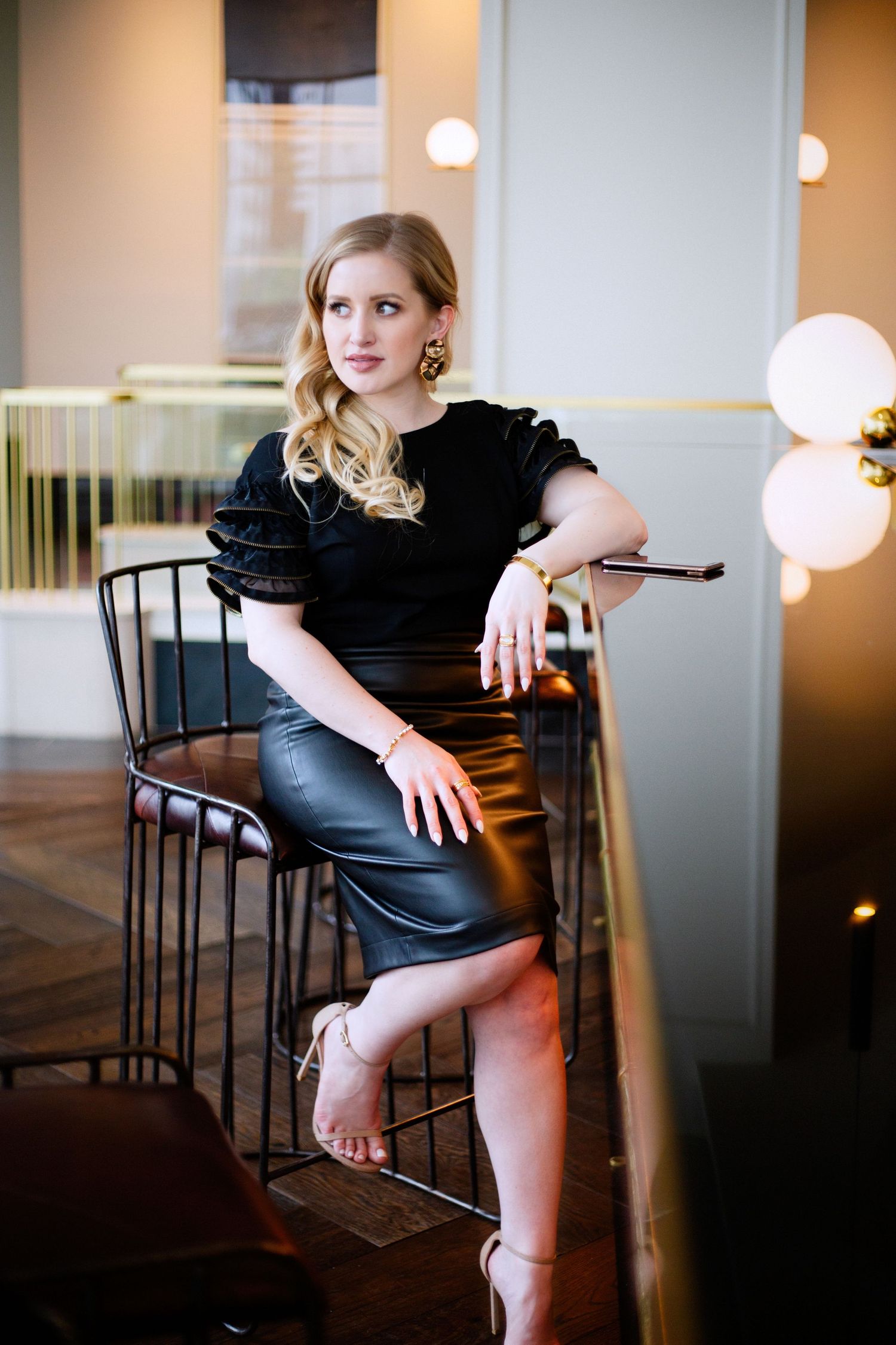 Beautiful business woman sitting at Bardot bar in Houston Tx