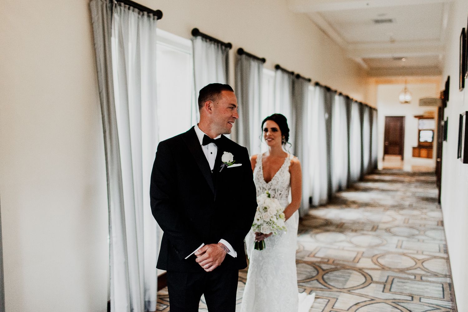 groom turning around to see bride for first time in wedding dress