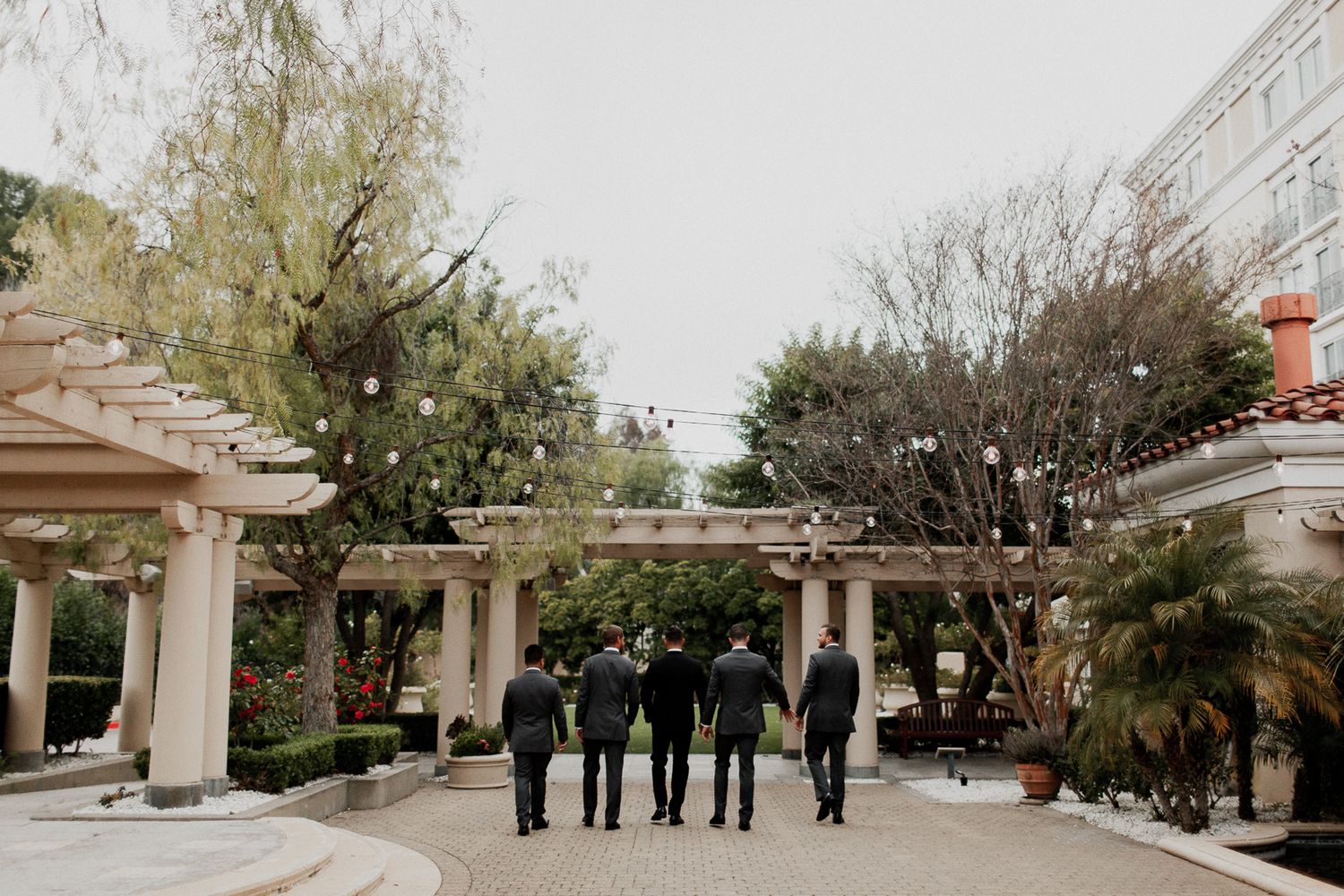 groomsmen walking away candid