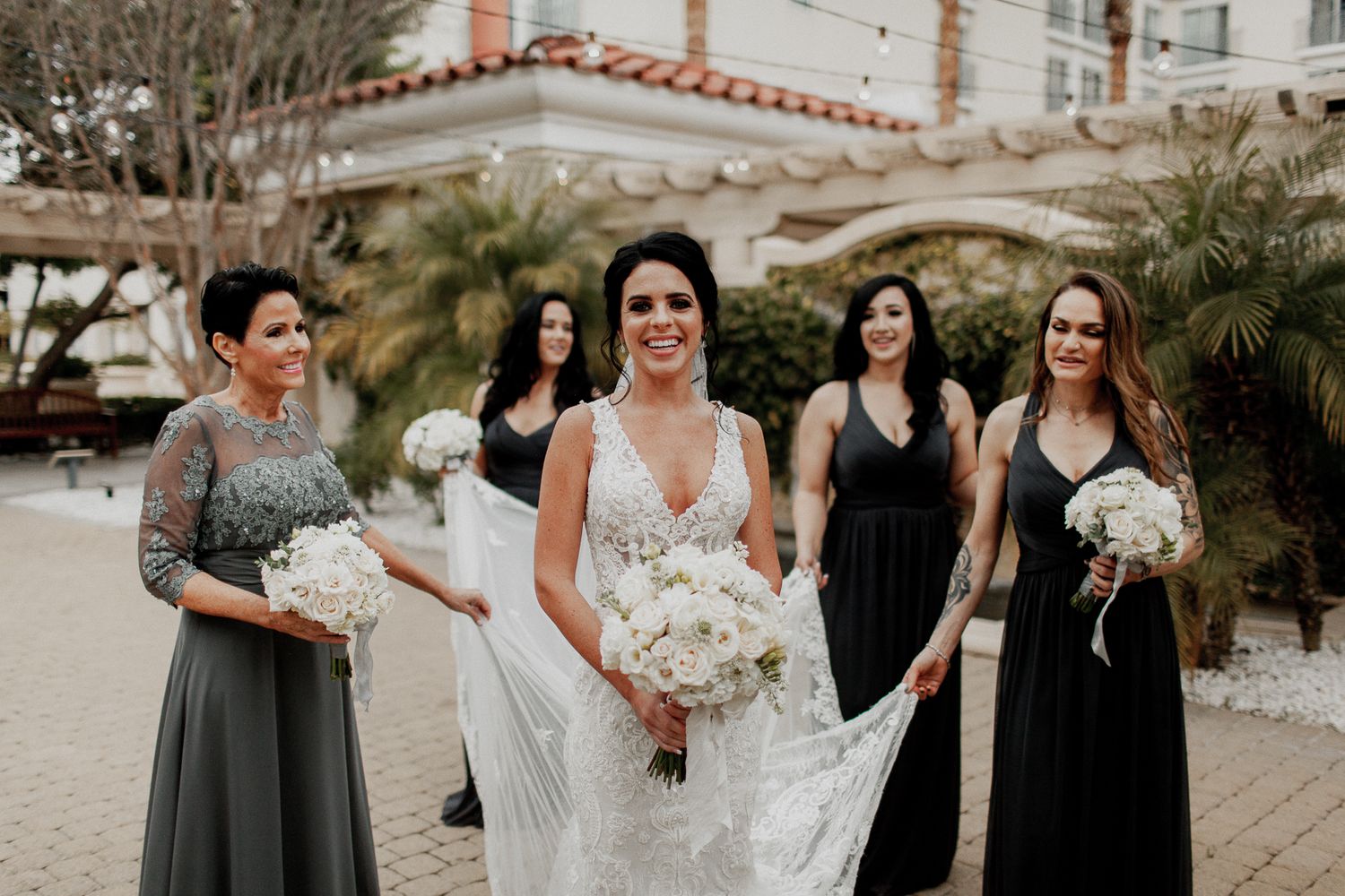 bride looking while bridesmaids talk