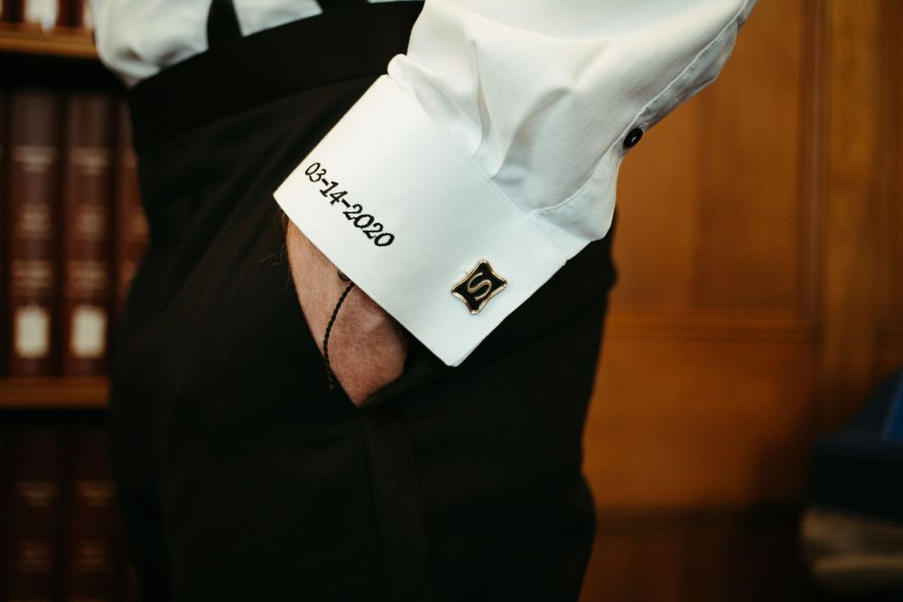 groom-cufflinks-and-wedding-date-wedding-cowles-library-desmoines-iowa-raelyn-ramey-photography