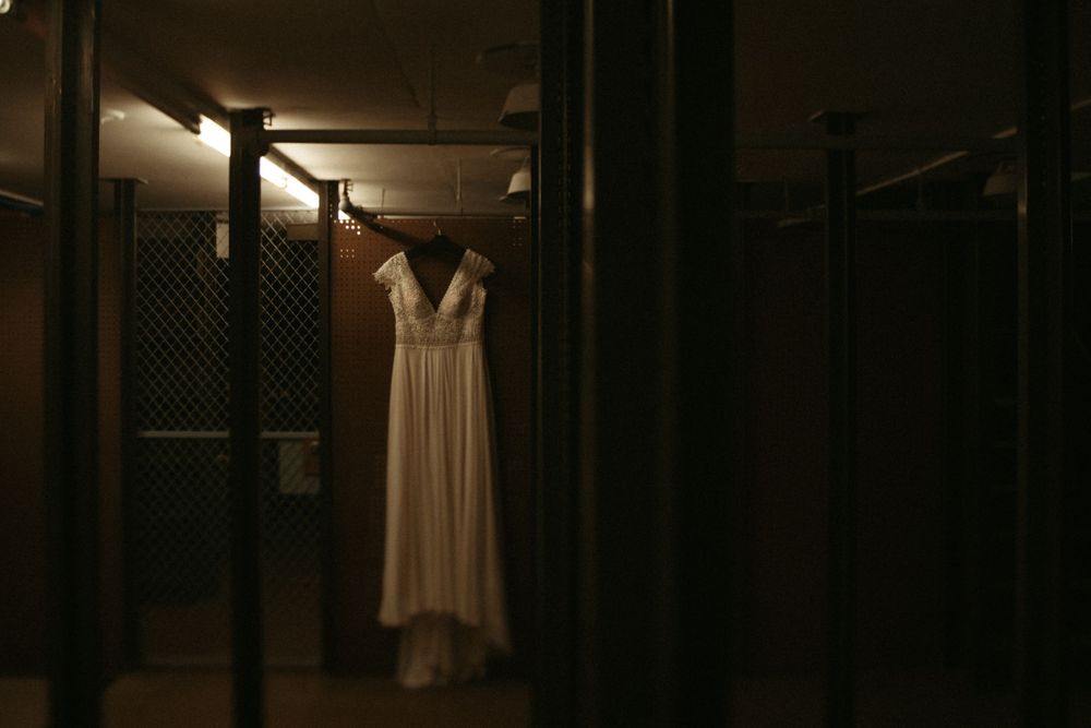 bridal-boutique-dress-hanging-up-cowles-library-desmoines-iowa-raelyn-ramey-photography