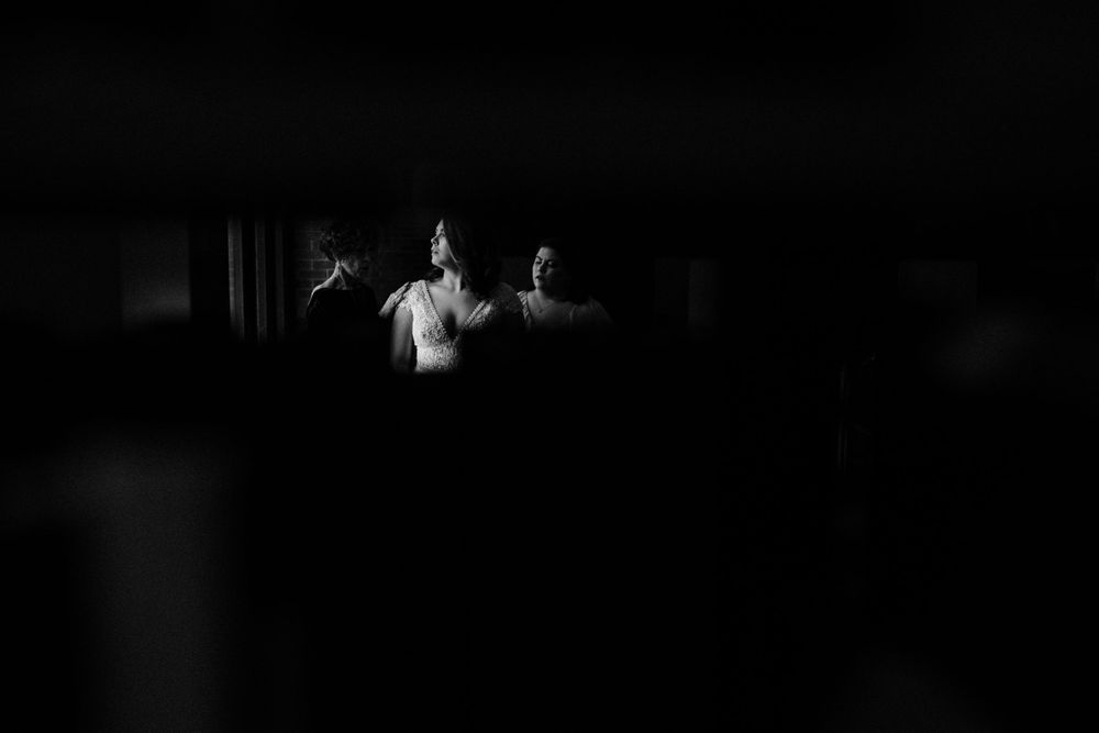 bride-getting-ready-in-library-wedding-cowles-library-desmoines-iowa-raelyn-ramey-photography