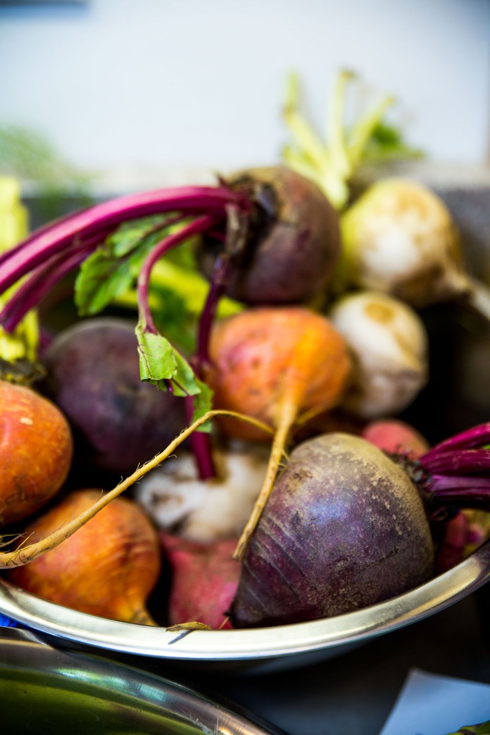 Stainless steel bowl of rainbow beets by Basil, Garlic & Rosemary Cooking Classes based in Annapolis, MD. | DANIE