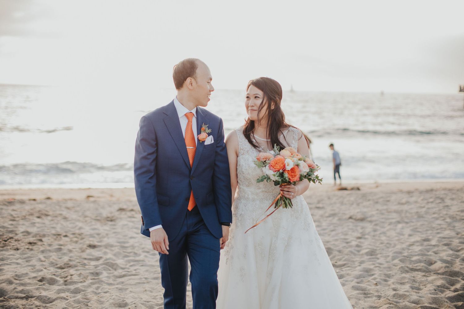 bride & groom walking on the sand redondo beach