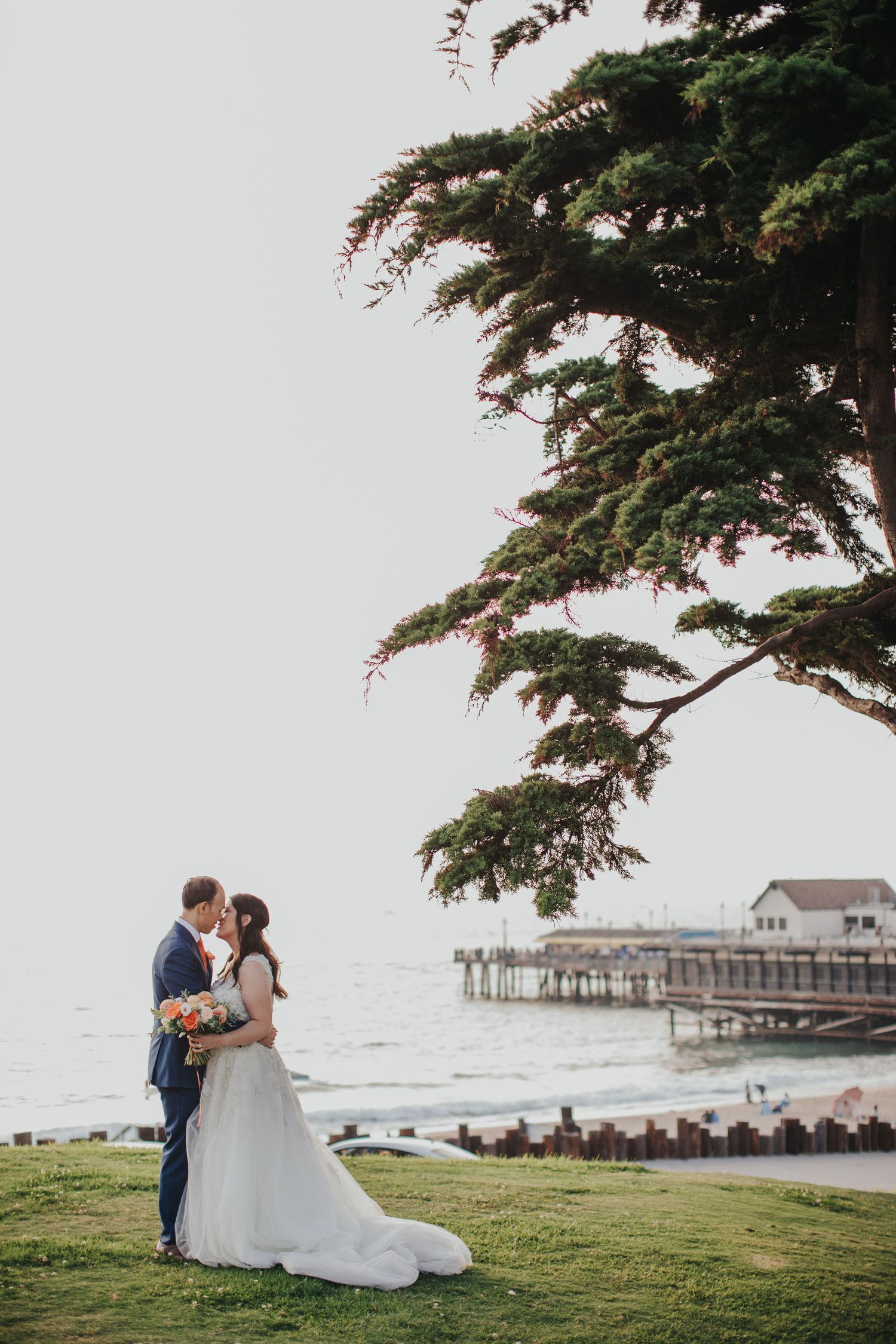 bride & groom overlooking redondo beach pier